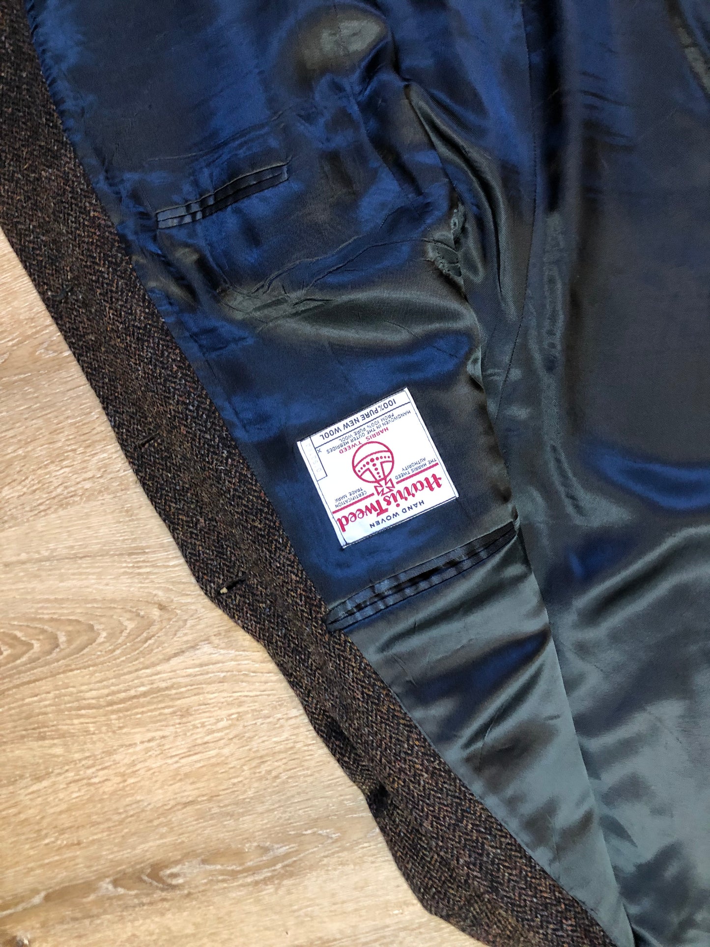 Kingspier Vintage - Harris Tweed brown and blue herringbone 100% wool jacket. This jacket is a three button, notch lapel with two flap pockets, a breast pocket and three inside pockets. Made in the Czech Republic.