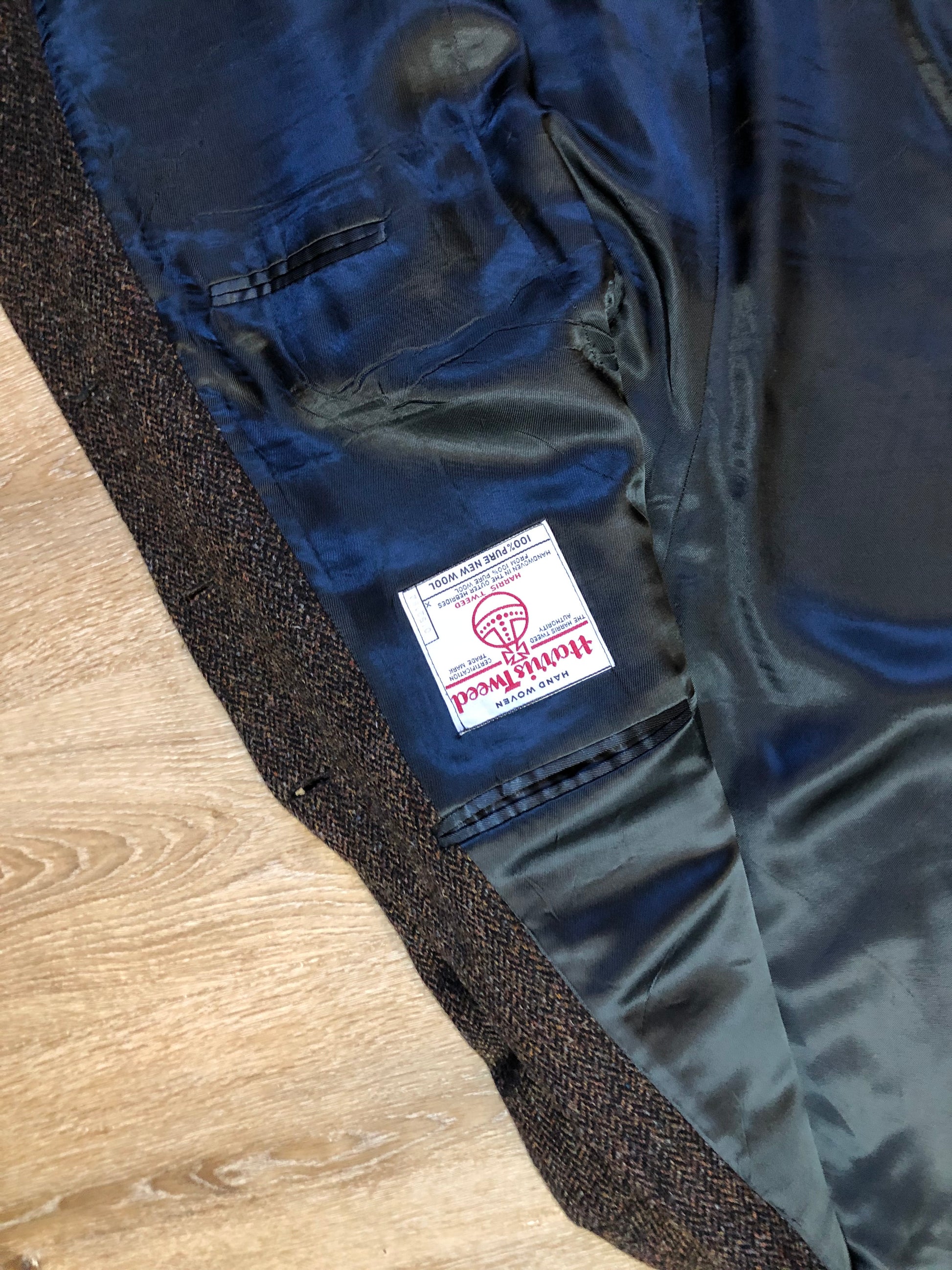 Kingspier Vintage - Harris Tweed brown and blue herringbone 100% wool jacket. This jacket is a three button, notch lapel with two flap pockets, a breast pocket and three inside pockets. Made in the Czech Republic.