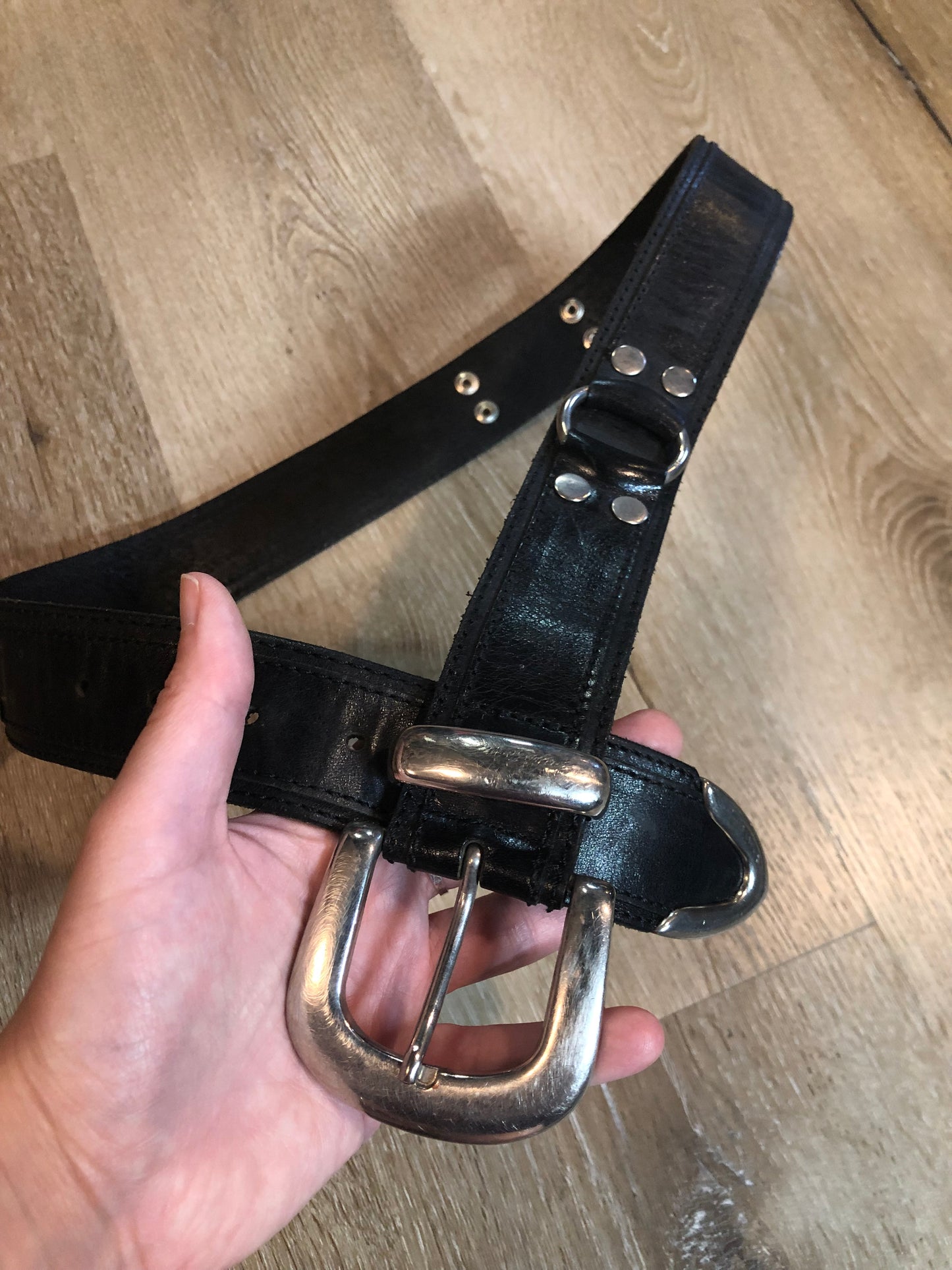 Kingspier Vintage - Vintage Guess Black Leather Belt with silver buckle and ring and grommet details.