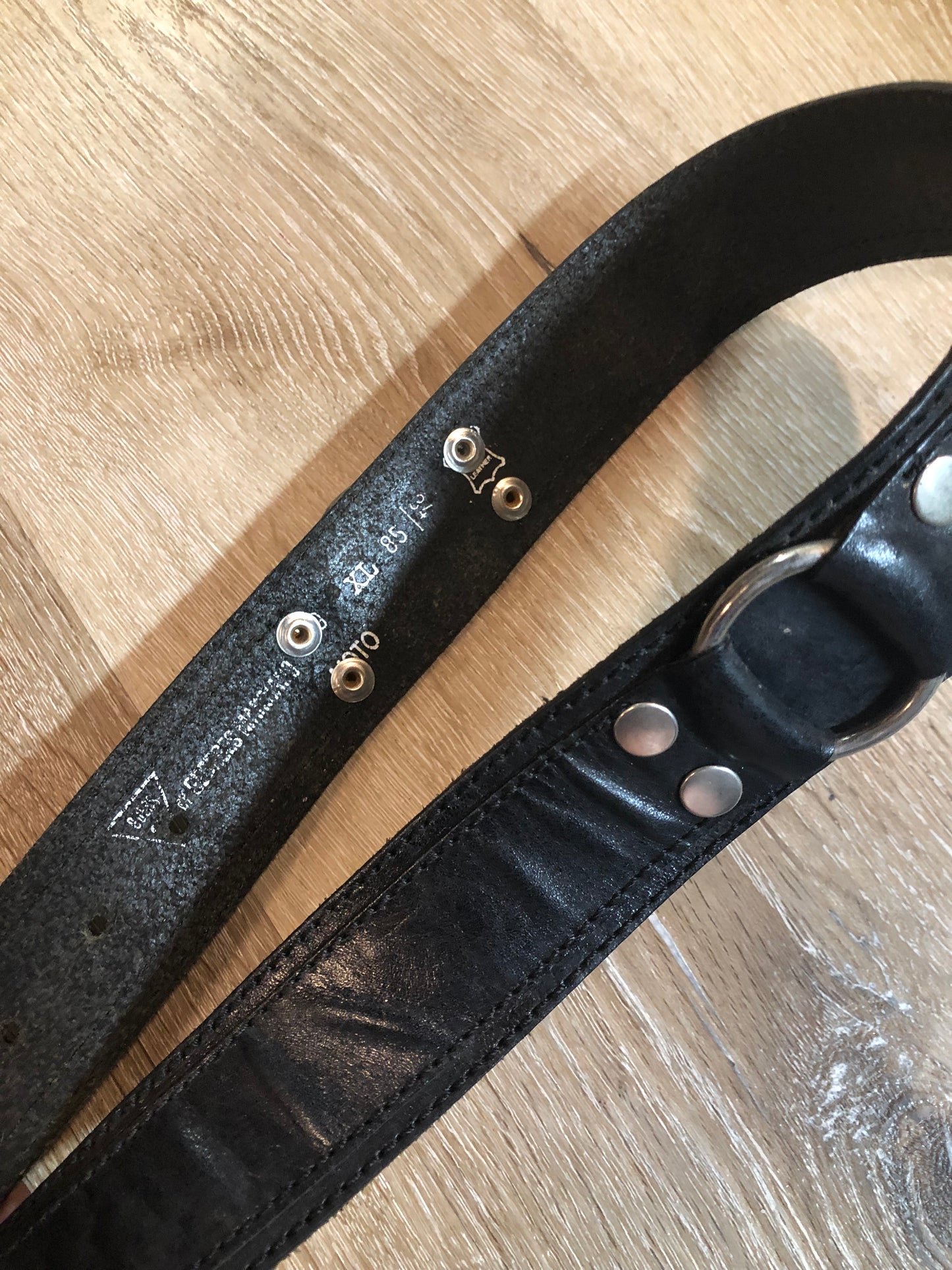Kingspier Vintage - Vintage Guess Black Leather Belt with silver buckle and ring and grommet details.