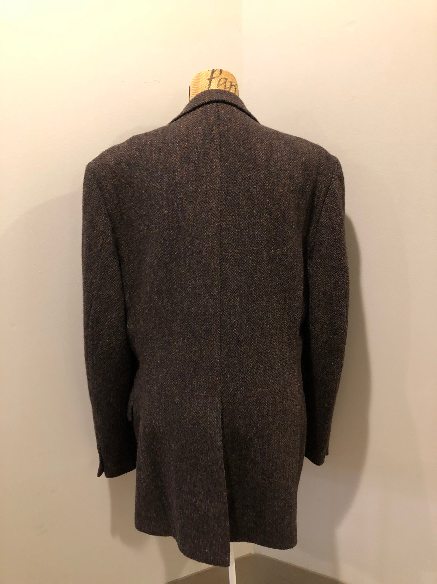 Kingspier Vintage - Harris Tweed brown and blue herringbone 100% wool jacket. This jacket is a three button, notch lapel with two flap pockets, a breast pocket and three inside pockets. Made in the Czech Republic.