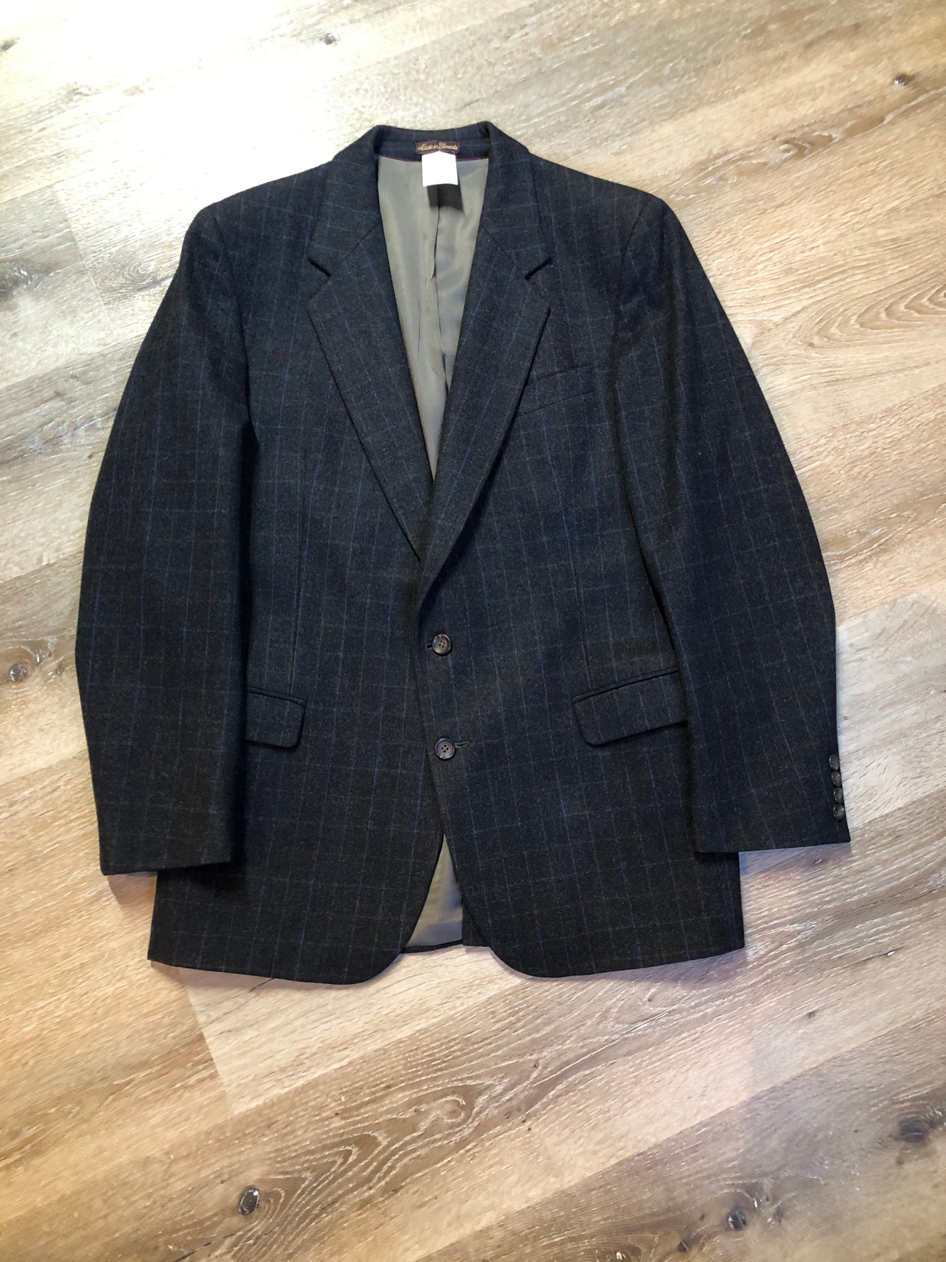 Kingspier Vintage - Chaps by Ralph Lauren slate grey with blue and red subtle stripe 100% wool jacket. This jacket is a two button, notch lapel with two flap pockets, a breast pocket and three inside pockets. Made in Canada.