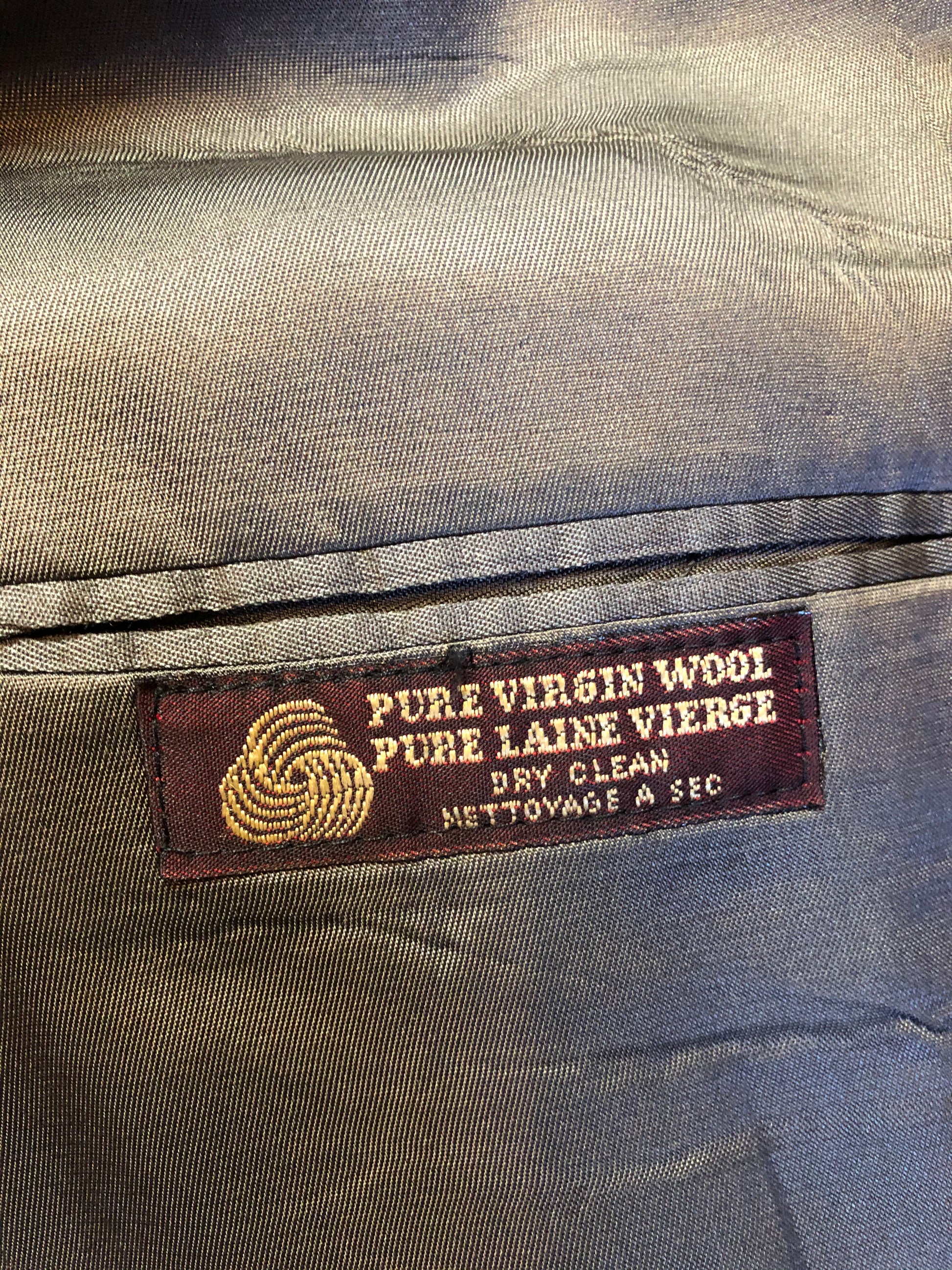 Kingspier Vintage - Chaps by Ralph Lauren slate grey with blue and red subtle stripe 100% wool jacket. This jacket is a two button, notch lapel with two flap pockets, a breast pocket and three inside pockets. Made in Canada.