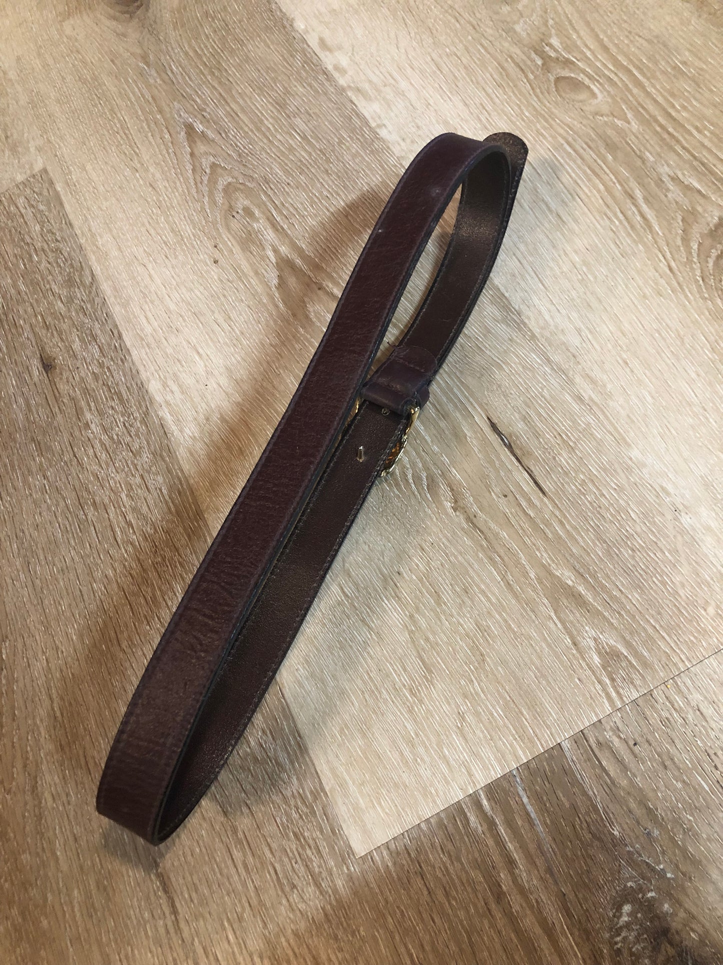Kingspier Vintage - Vintage Ann Klein Caleche brown textured leather belt with gold lion’s head buckle.