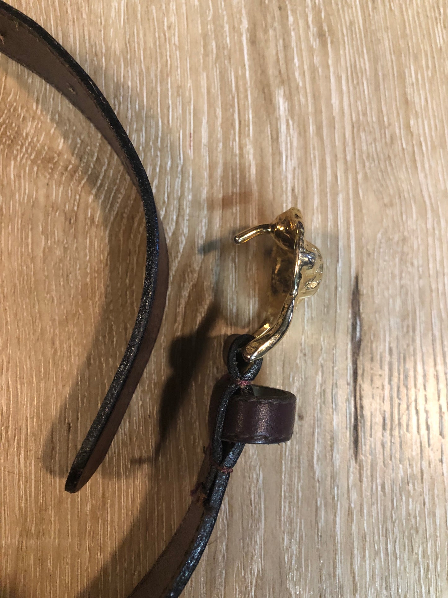 Kingspier Vintage - Vintage Ann Klein Caleche brown textured leather belt with gold lion’s head buckle.