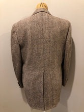 Load image into Gallery viewer, Kingspier Vintage - Harris Tweed beige with rust and grey flecks 100% wool tweed jacket. This jacket is a two button, notch lapel with two flap pockets, a breast pocket and two inside pockets. Made in Canada. Size 42R.
