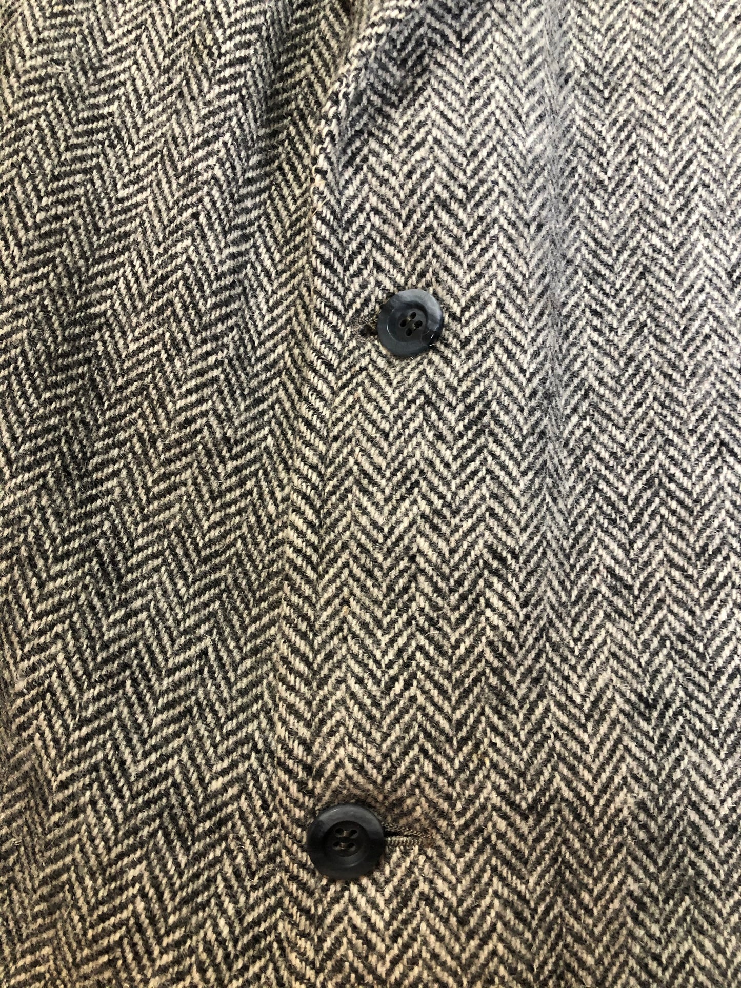 Kingspier Vintage - Morris Goldberg’s grey herringbone 100% wool tweed jacket. This jacket is a two button, notch lapel with two flap pockets, a breast pocket and three inside pockets. Made in Halifax, Nova Scotia.