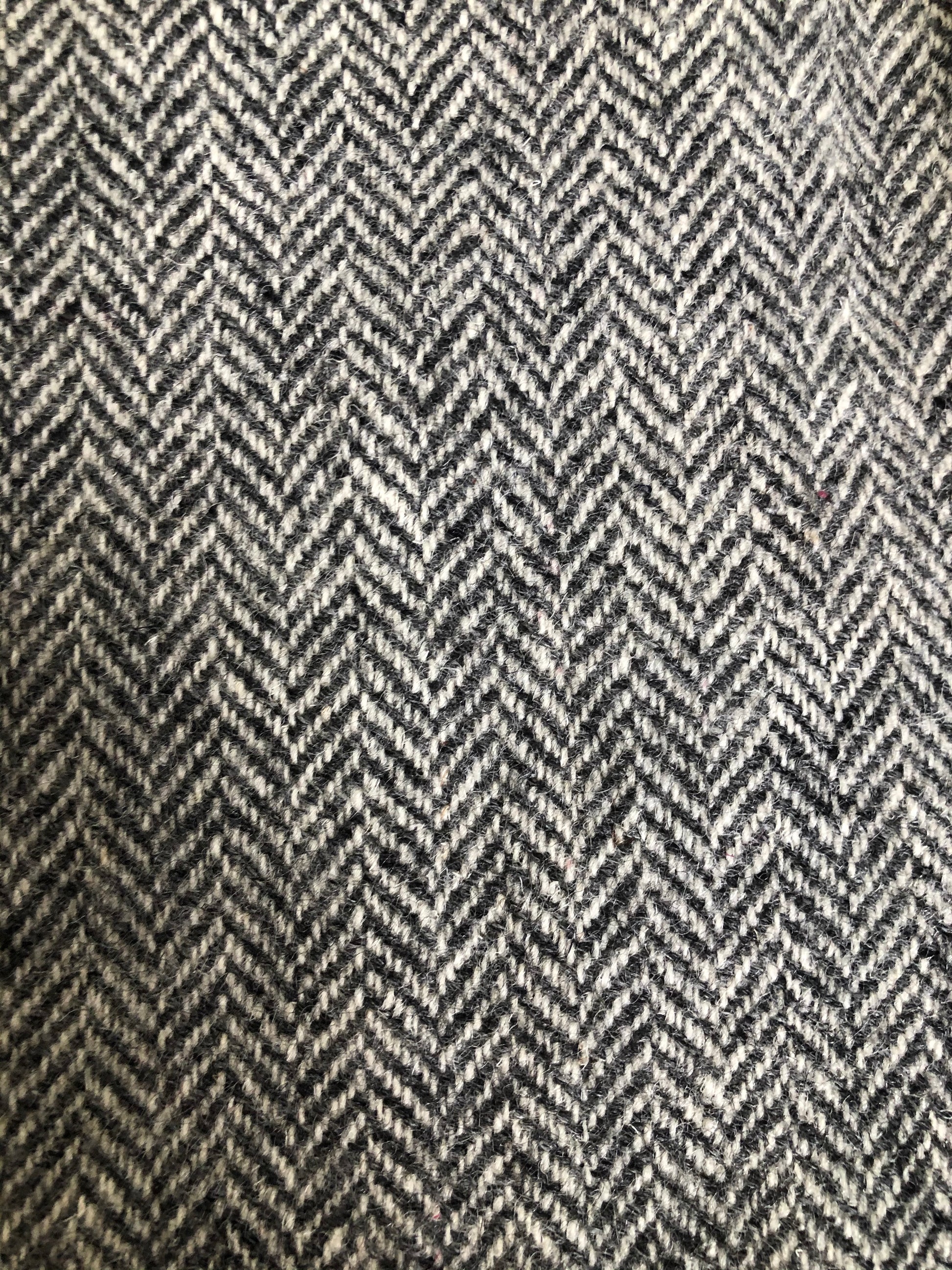 Kingspier Vintage - Morris Goldberg’s grey herringbone 100% wool tweed jacket. This jacket is a two button, notch lapel with two flap pockets, a breast pocket and three inside pockets. Made in Halifax, Nova Scotia.