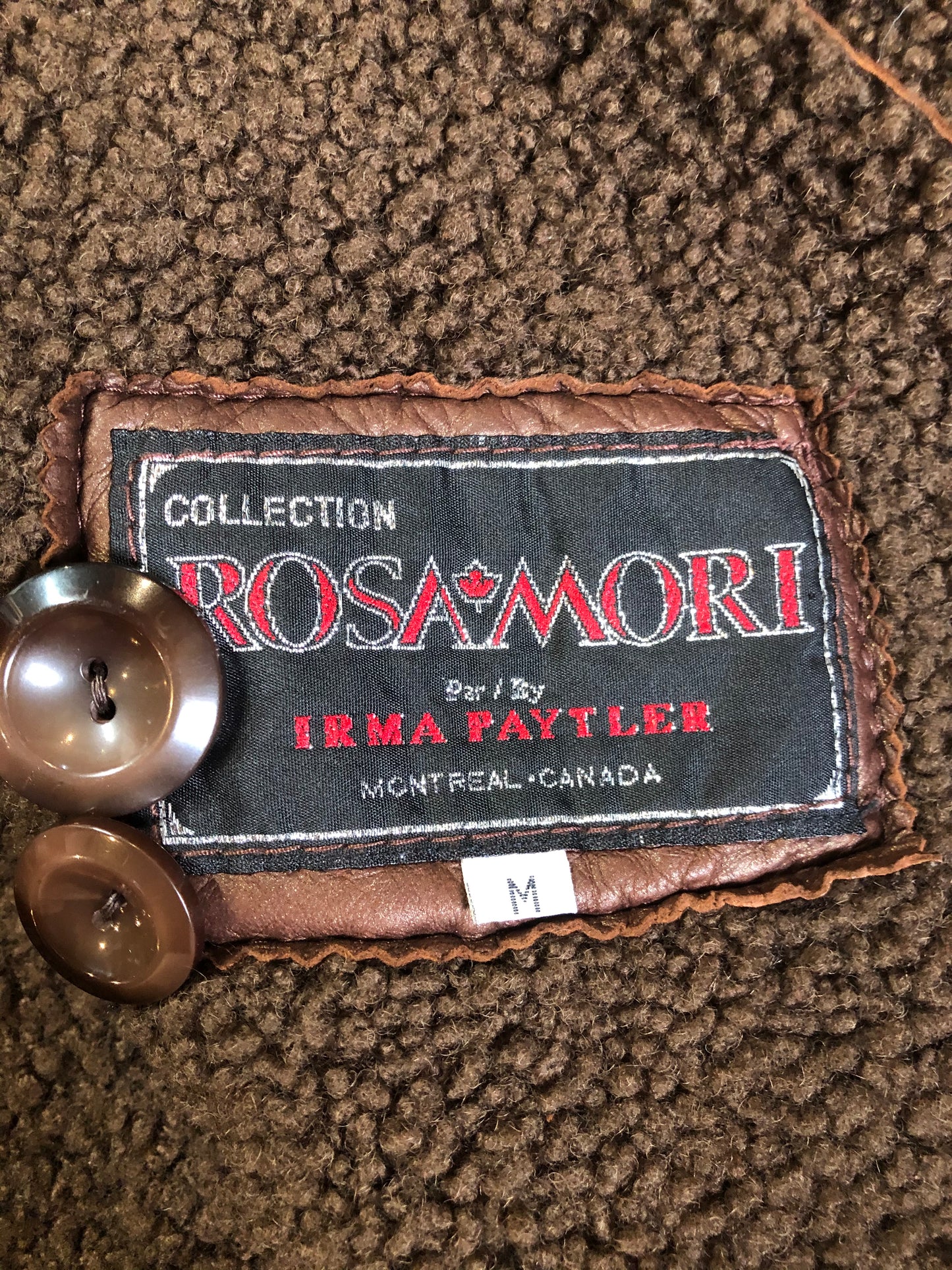 Kingspier Vintage - Rosa Mori by Irma Taylor medium brown shearling coat. This coat features a bronze iridescent finish, shearling trim and lining, button closures and slash pockets. Made in Montreal, Canada, Size medium.