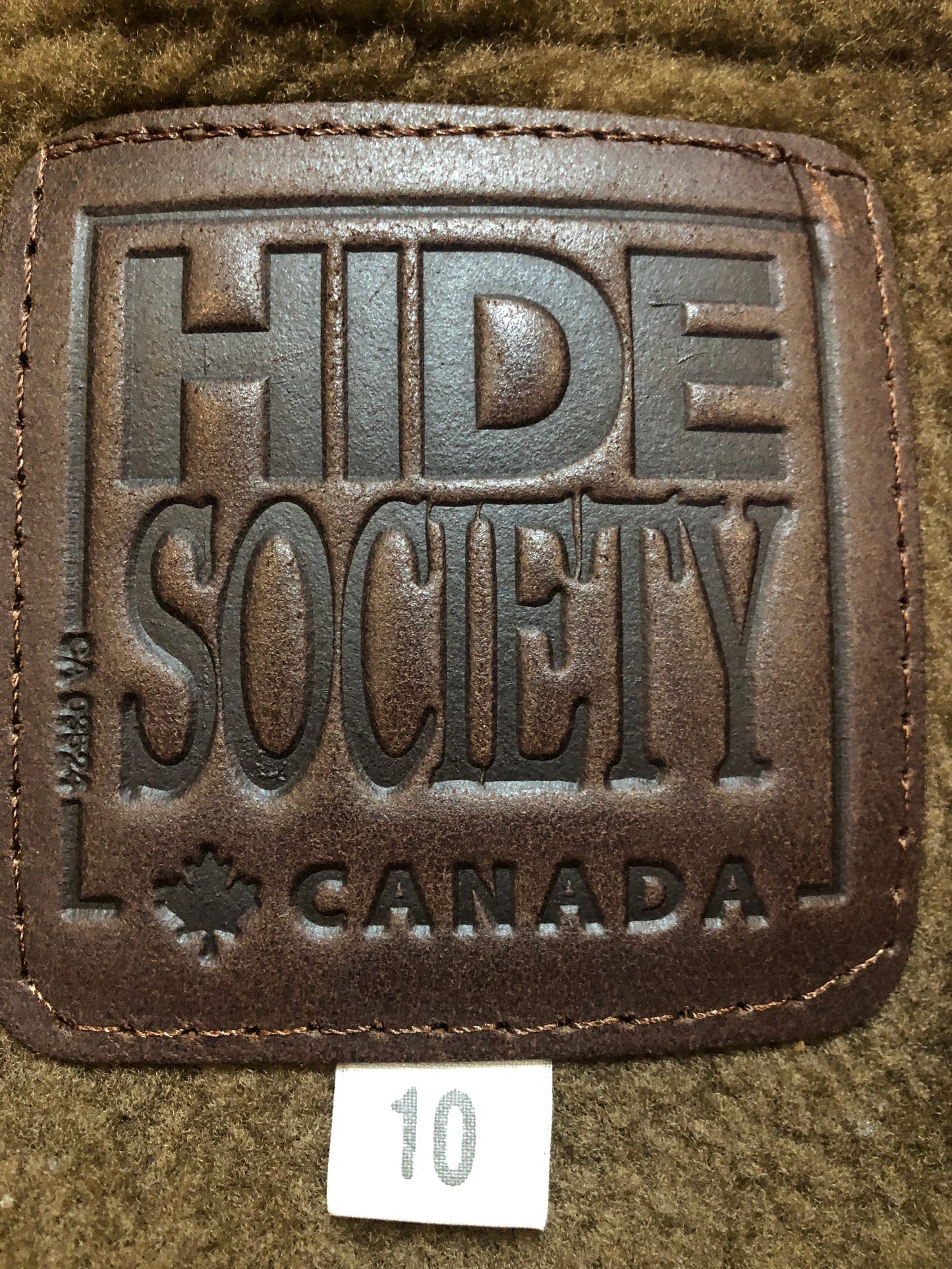 Kingspier Vintage - Hide Society medium brown shearling coat This coat features shearling lining, button closures, pockets and one inside zip pocket. Made in Canada. Size 10.