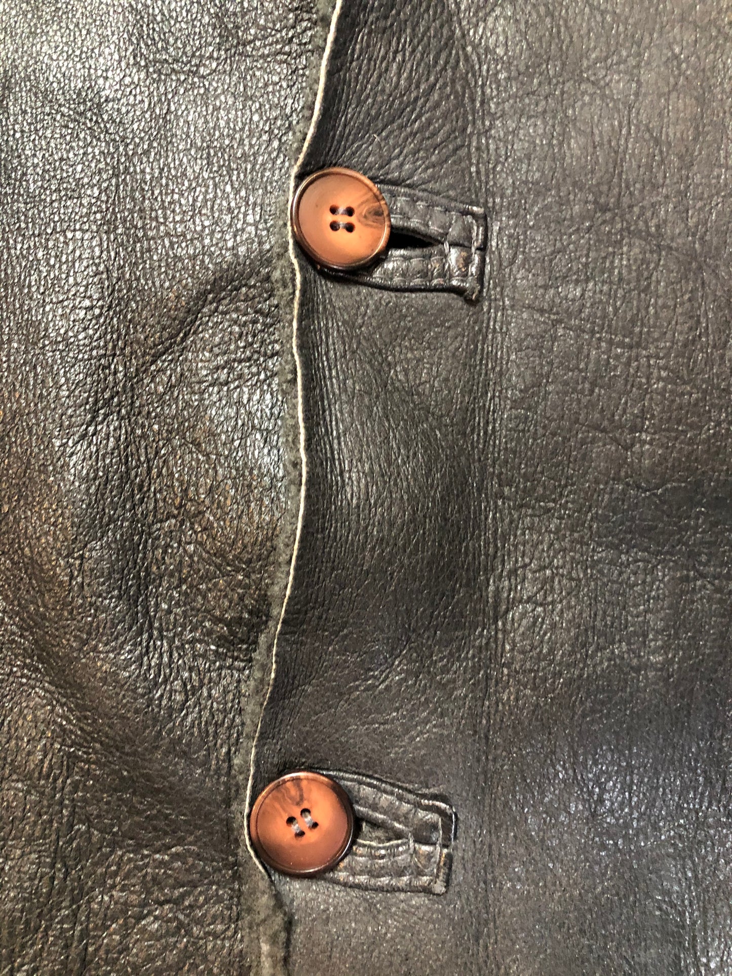Kingspier Vintage - Reilly Olmes espresso brown coat with grey/ green shearling trim and lining, button closures and vertical pockets. Made in Argentina. Size large.