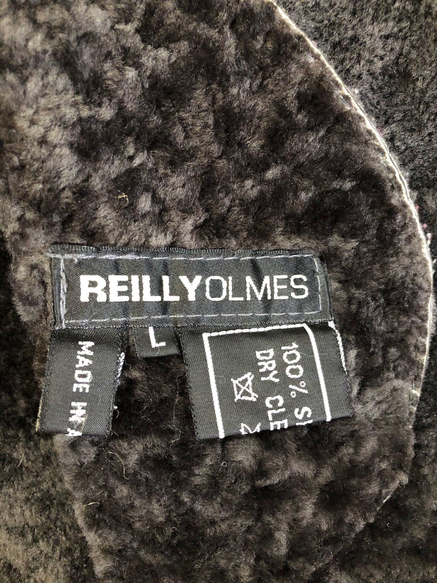 Kingspier Vintage - Reilly Olmes espresso brown coat with grey/ green shearling trim and lining, button closures and vertical pockets. Made in Argentina. Size large.