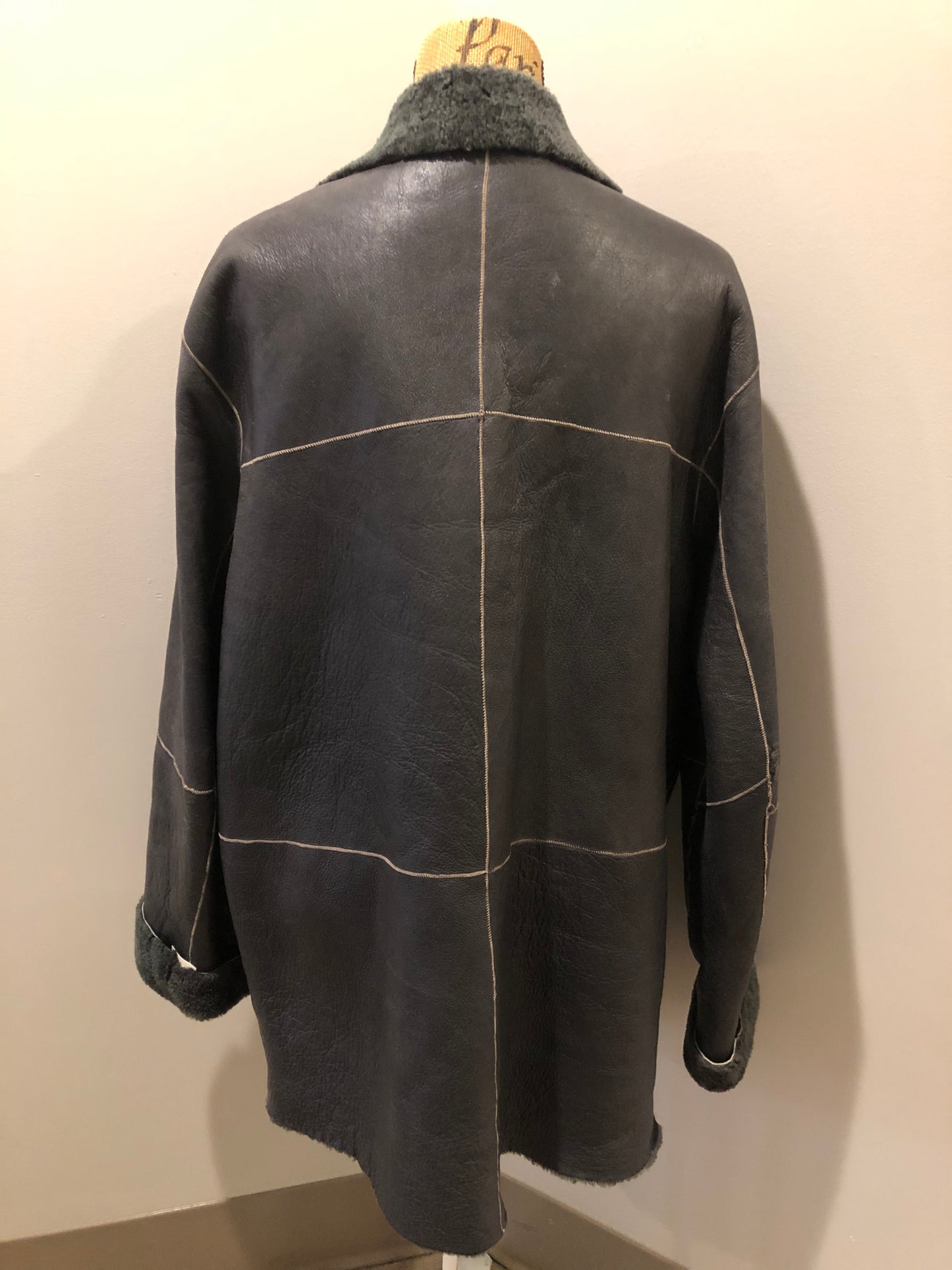 Kingspier Vintage - Reilly Olmes espresso brown coat with grey/ green shearling trim and lining, button closures and vertical pockets. Made in Argentina. Size large.