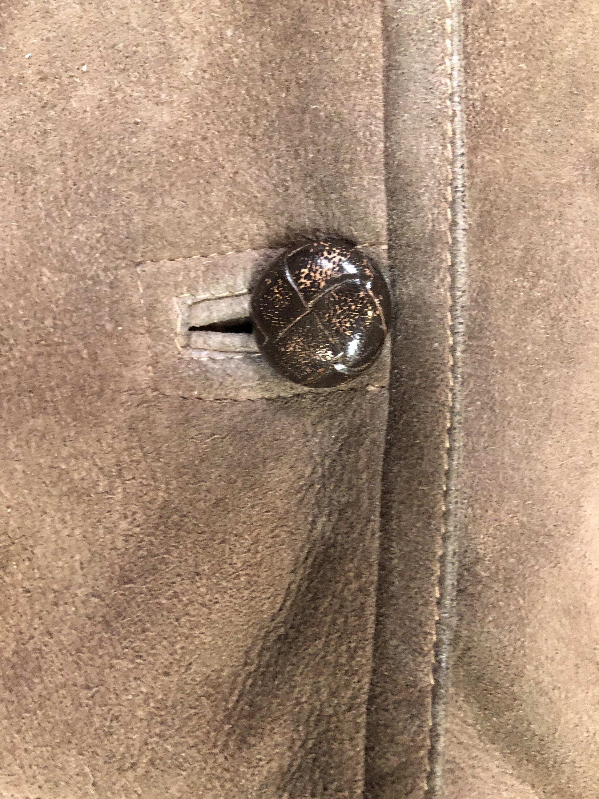 Kingspier Vintage - Bovet medium brown shearling coat. This coat features shearling trim and lining, wooden button closures and patch pockets.