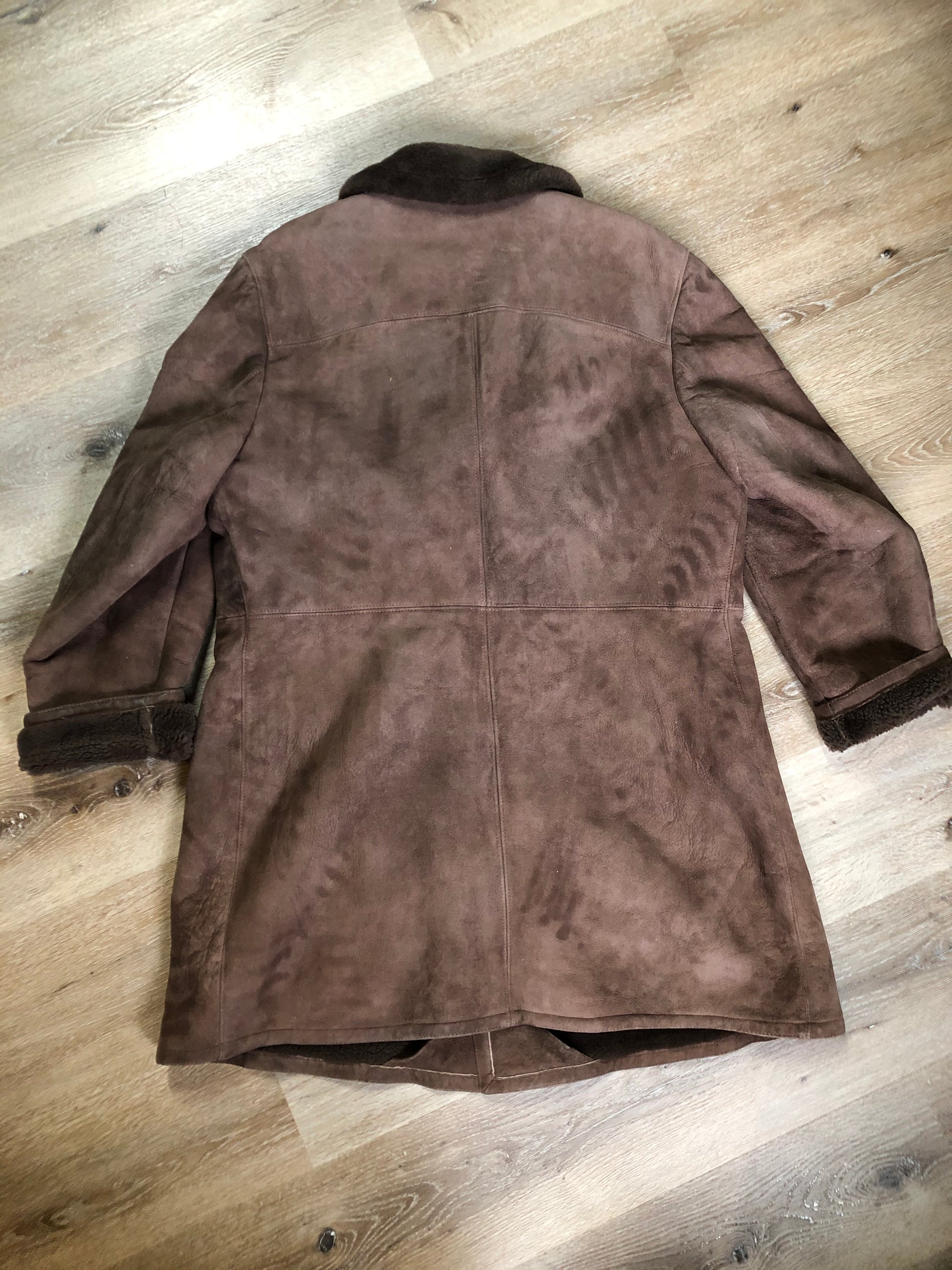 Kingspier Vintage - Bovet medium brown shearling coat. This coat features shearling trim and lining, wooden button closures and patch pockets.