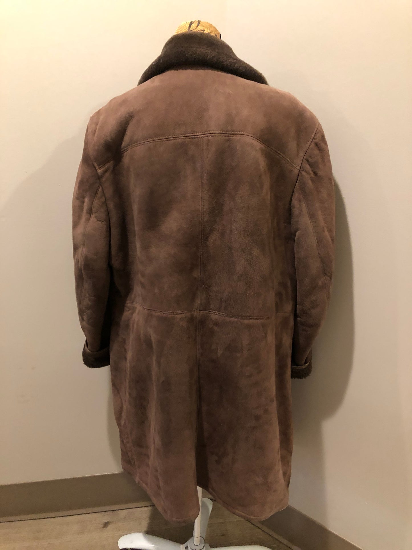 Kingspier Vintage - Bovet medium brown shearling coat. This coat features shearling trim and lining, wooden button closures and patch pockets.