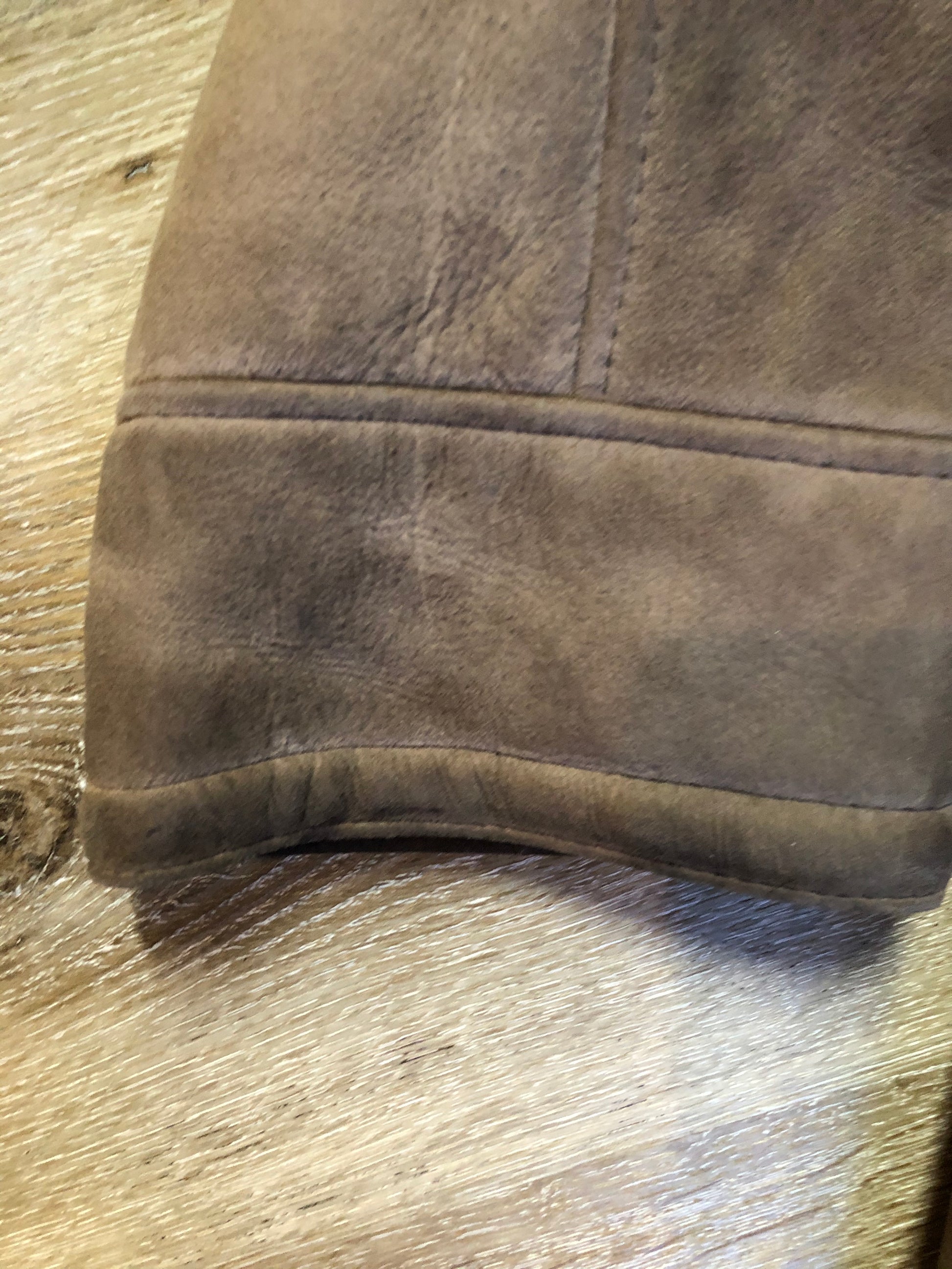 Kingspier Vintage - Medium brown suede coat with shearling trim and lining, button closures and patch pockets.