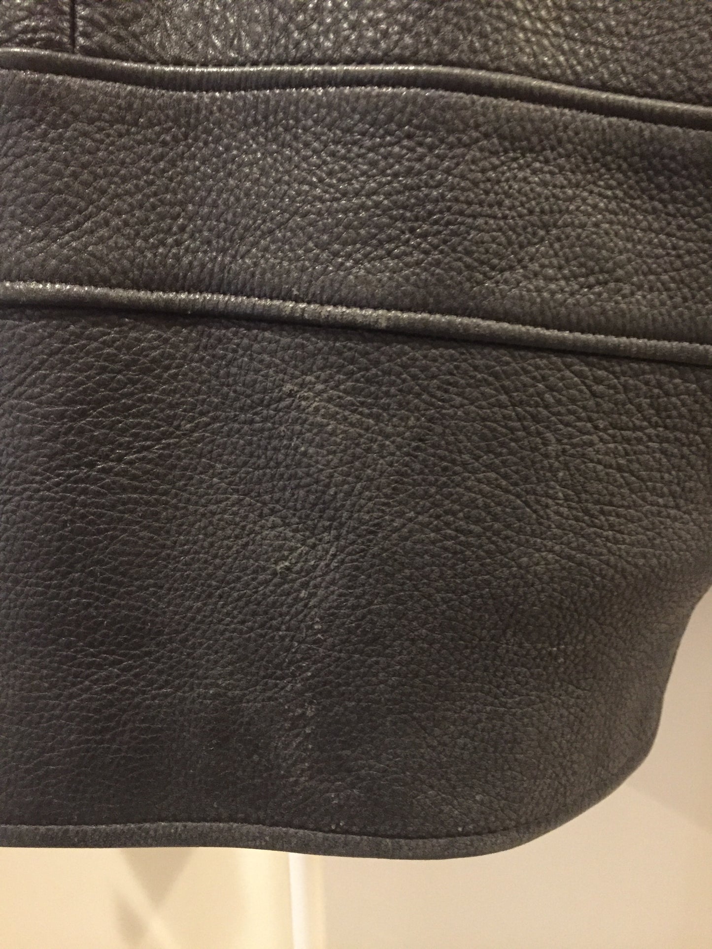 Kingspier Vintage - Roots black pebbled leather jacket with two vertical zip pockets and one zip pocket on the chest. Made in Canada. Size medium.