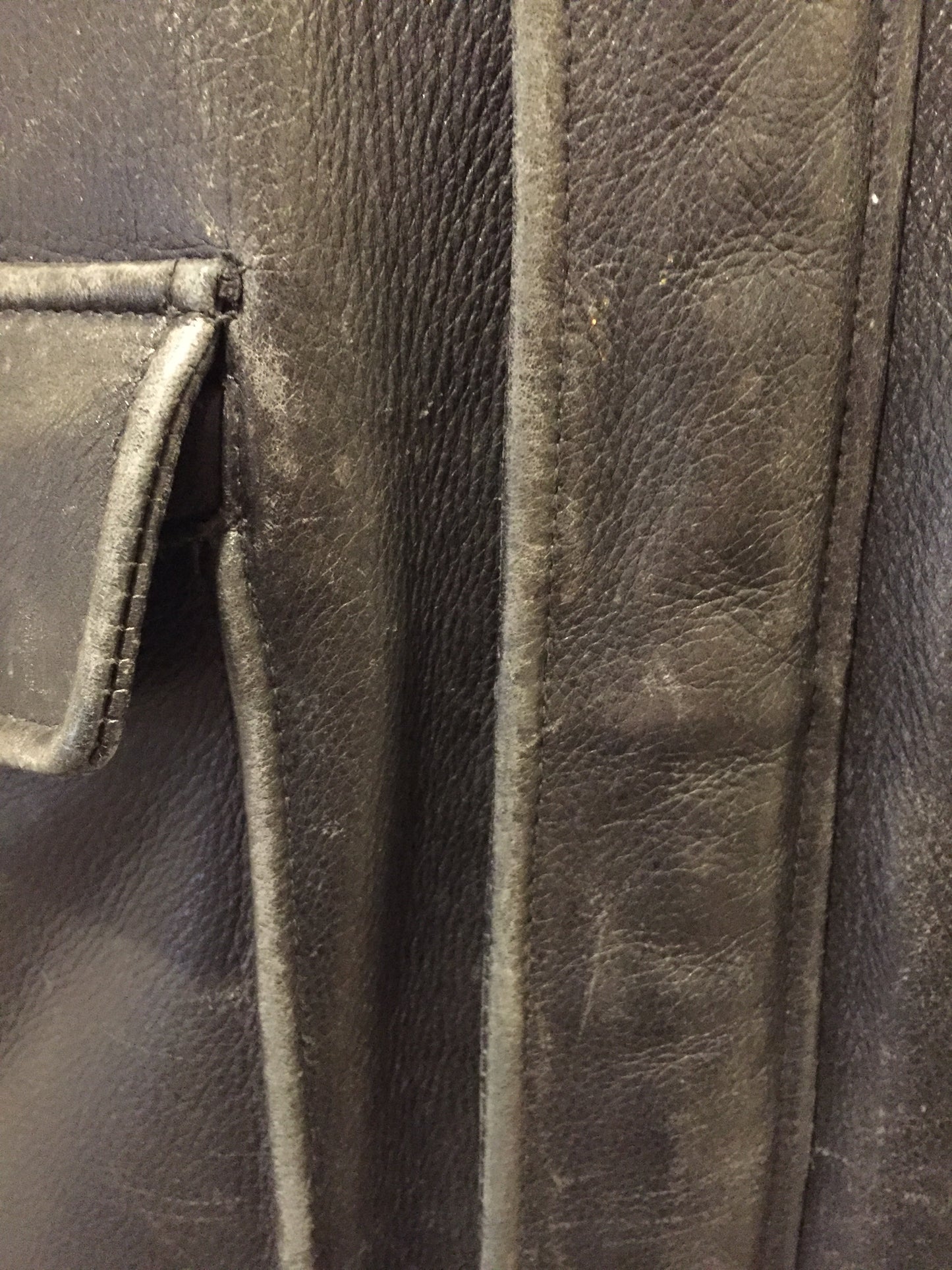 Kingspier Vintage - Black leather pilot jacket with zipper and snap closures, flap pockets, knit trim, inside pocket and plane pattern on inside lining. Size large.