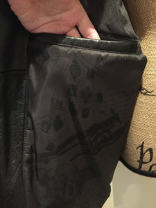 Kingspier Vintage - Black leather pilot jacket with zipper and snap closures, flap pockets, knit trim, inside pocket and plane pattern on inside lining. Size large. 