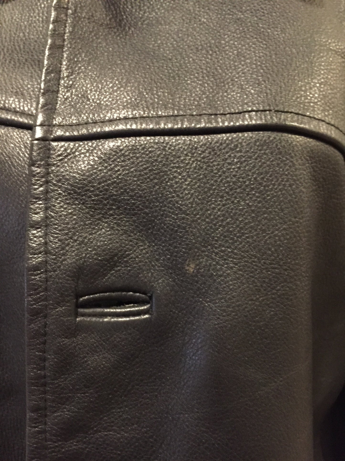 Kingspier Vintage - Gap black leather jacket with button closures, slash pockets, inside pocket and quilted lining. Size large.