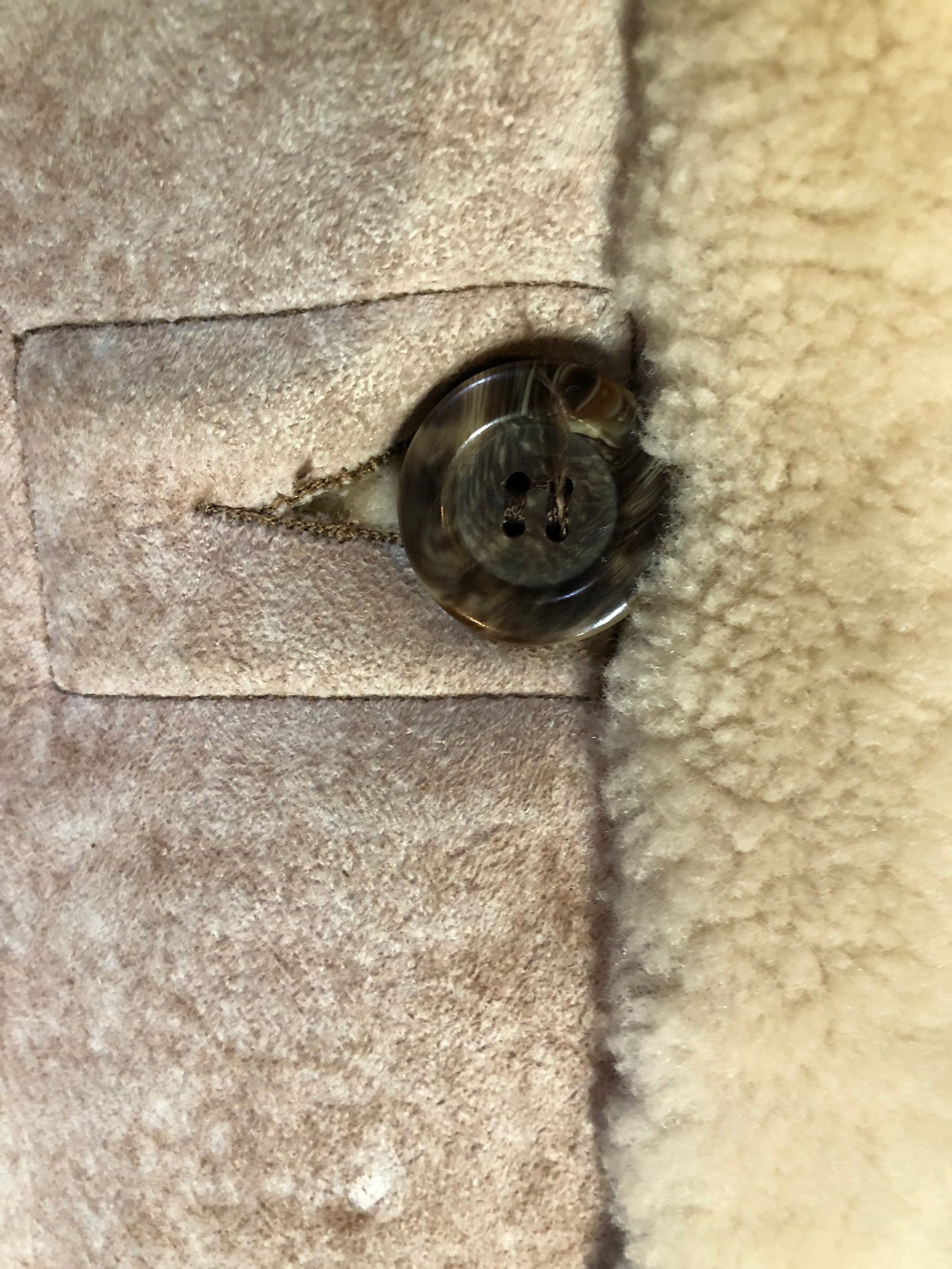 Kingspier Vintage - Dave Epstein “Rice Sportswear” beige suede coat with shearling trim and lining, button closures and patch pockets. Made in Canada.