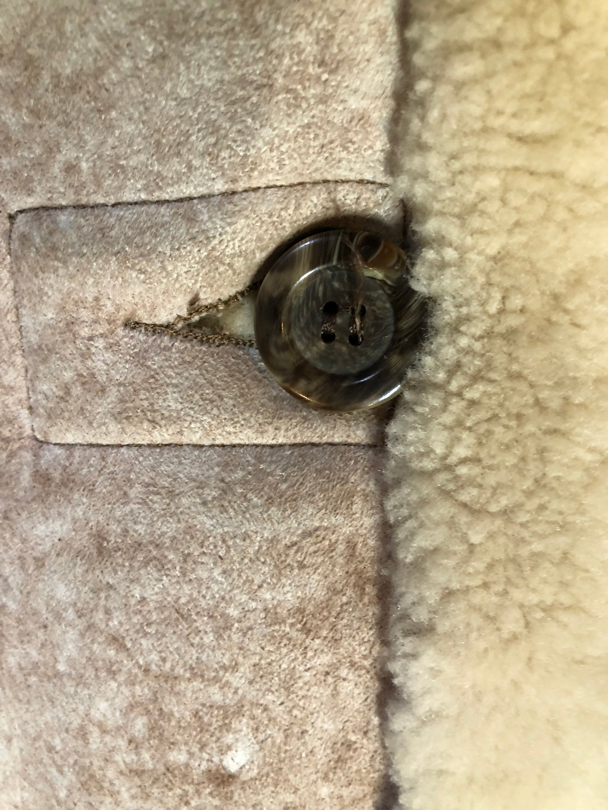 Kingspier Vintage - Dave Epstein “Rice Sportswear” beige suede coat with shearling trim and lining, button closures and patch pockets. Made in Canada.