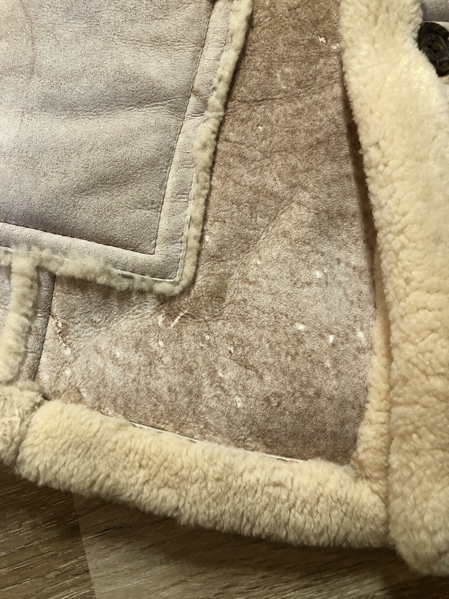 Kingspier Vintage - Dave Epstein “Rice Sportswear” beige suede coat with shearling trim and lining, button closures and patch pockets. Made in Canada.