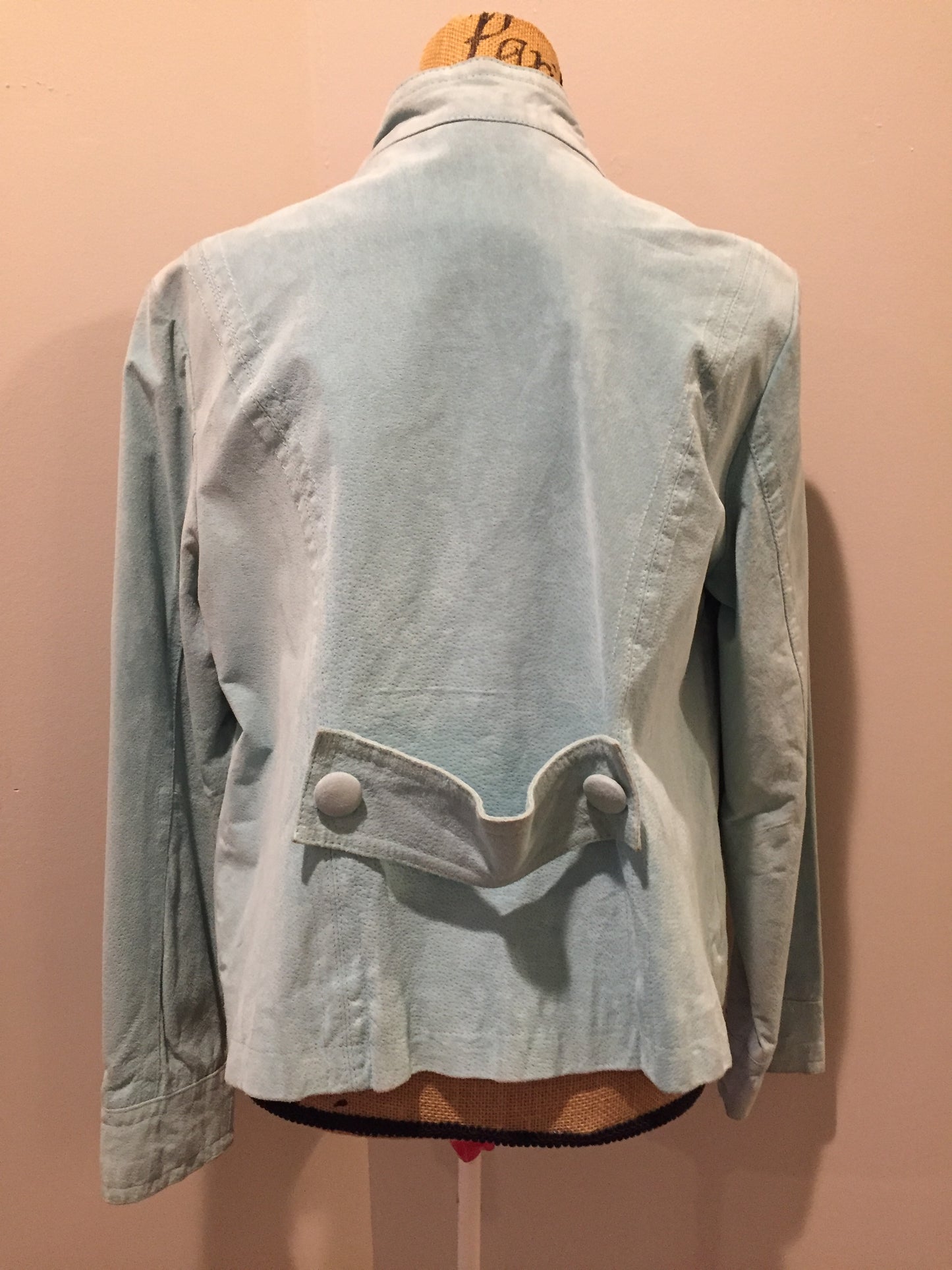 Kingspier Vintage - LAL “Live A LIttle” light teal suede jacket with hidden hook closures, brass grommets running down the front, two zip slash pockets and a small belt at the back. Size large.