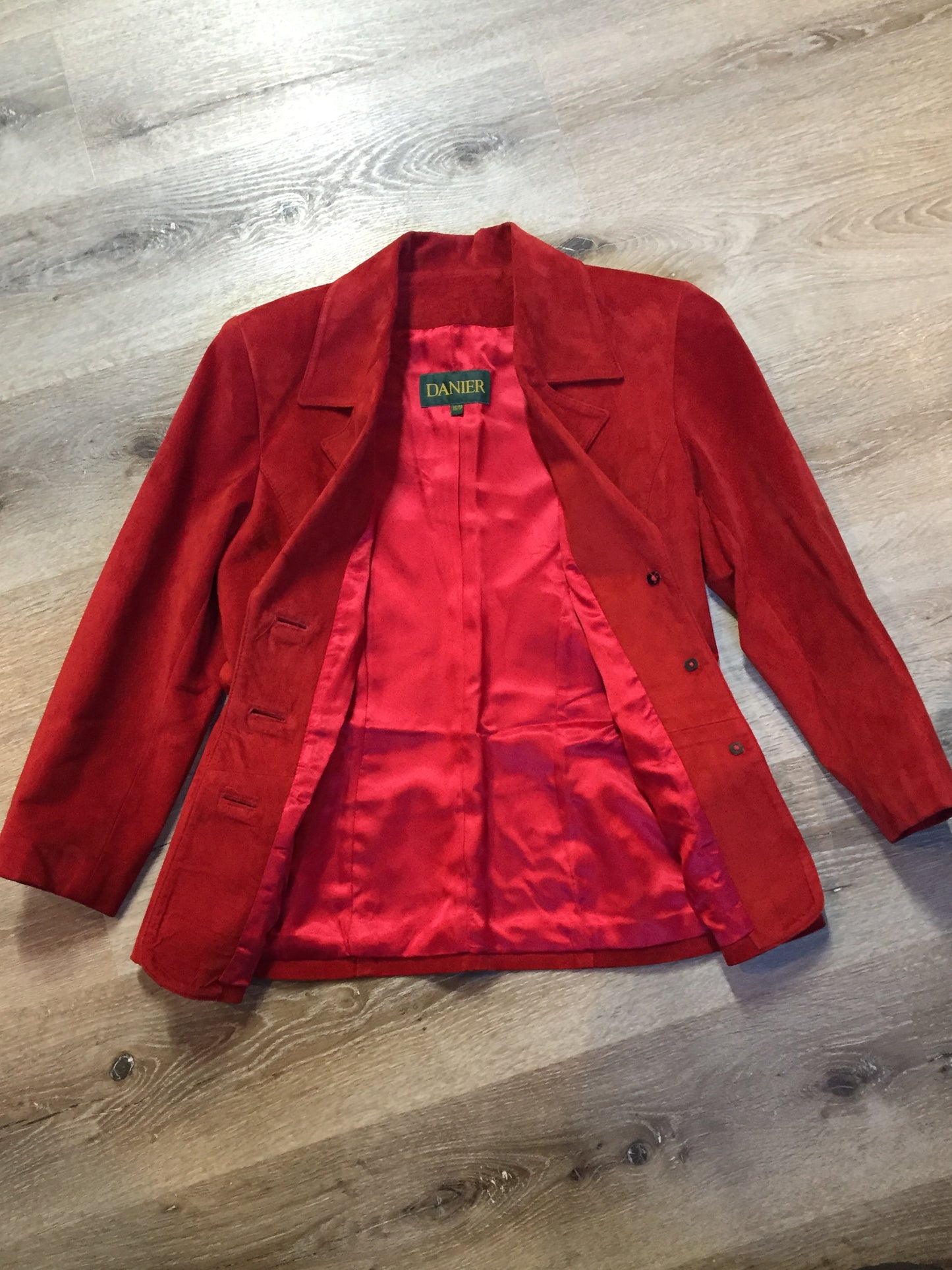 Kingspier Vintage - Danier red suede jacket with fitted silhouette, three gold decorative buttons and two slanted welt pockets. Size small.