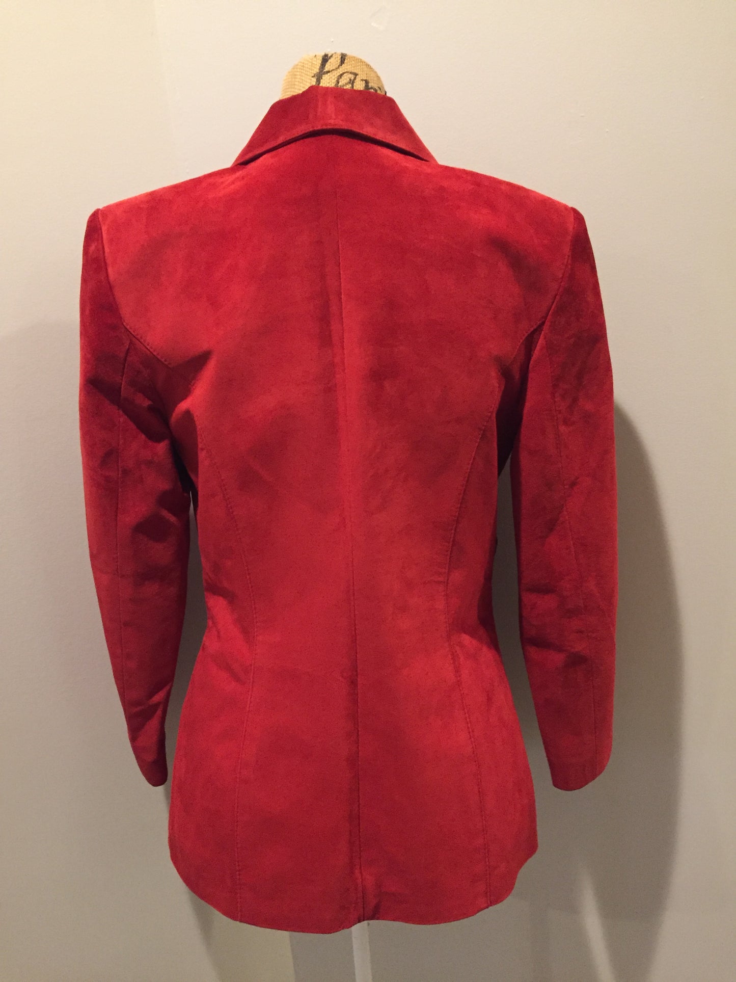 Kingspier Vintage - Danier red suede jacket with fitted silhouette, three gold decorative buttons and two slanted welt pockets. Size small.