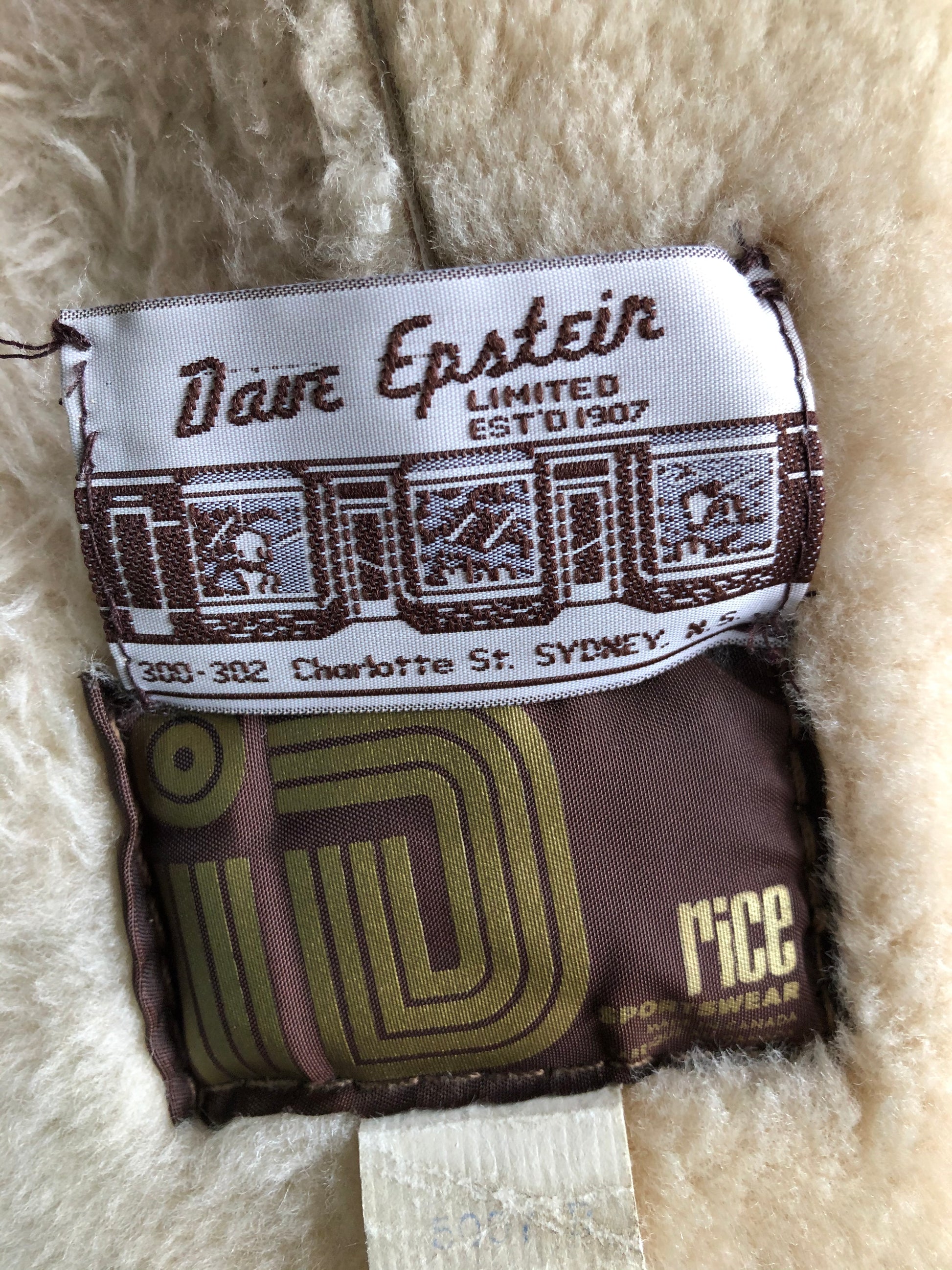 Kingspier Vintage - Dave Epstein “Rice Sportswear” beige suede coat with shearling trim and lining, button closures and patch pockets. Made in Canada.