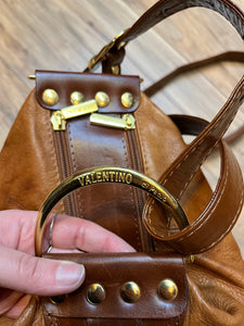 Vintage Valentino Di Paolo brown leather bucket bag/ knapsack with brass hardware, multi-pockets and multi- zip.

Made in Italy