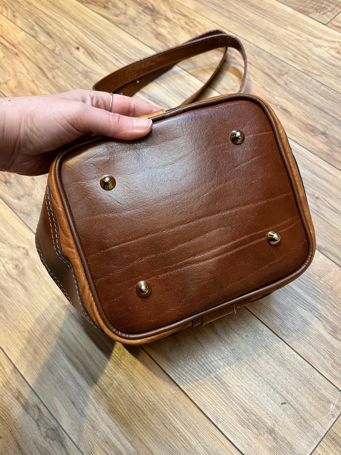 Vintage Valentino Di Paolo brown leather bucket bag/ knapsack with brass hardware, multi-pockets and multi- zip.
Made in Italy