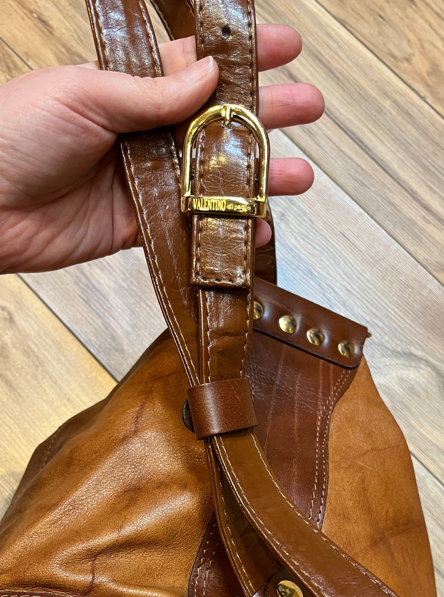 Vintage Valentino Di Paolo brown leather bucket bag/ knapsack with brass hardware, multi-pockets and multi- zip.
Made in Italy