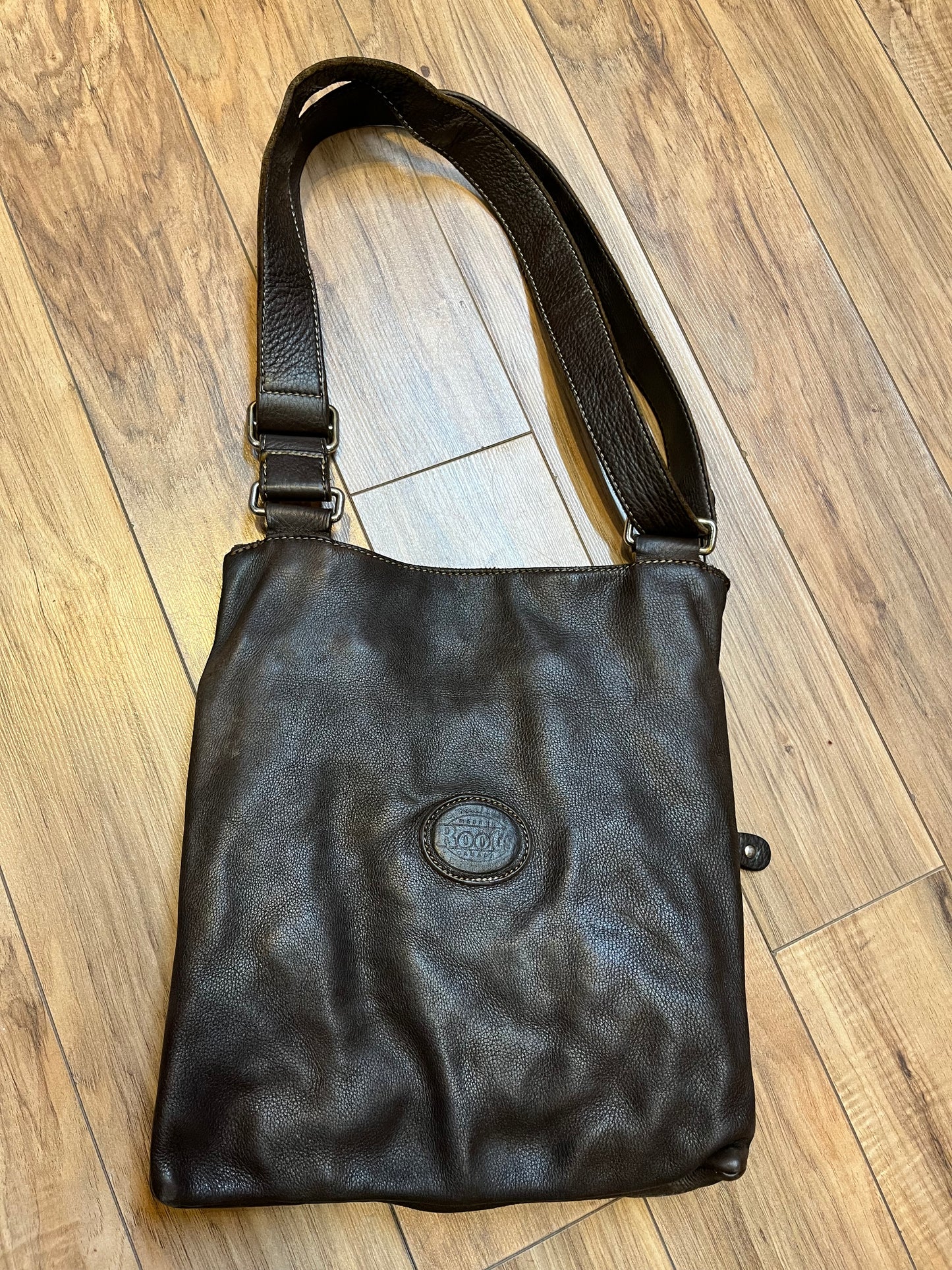 Vintage Roots Tribal Leather brown crossbody bag with adjustable shoulder strap, multiple compartments and turn key detail.