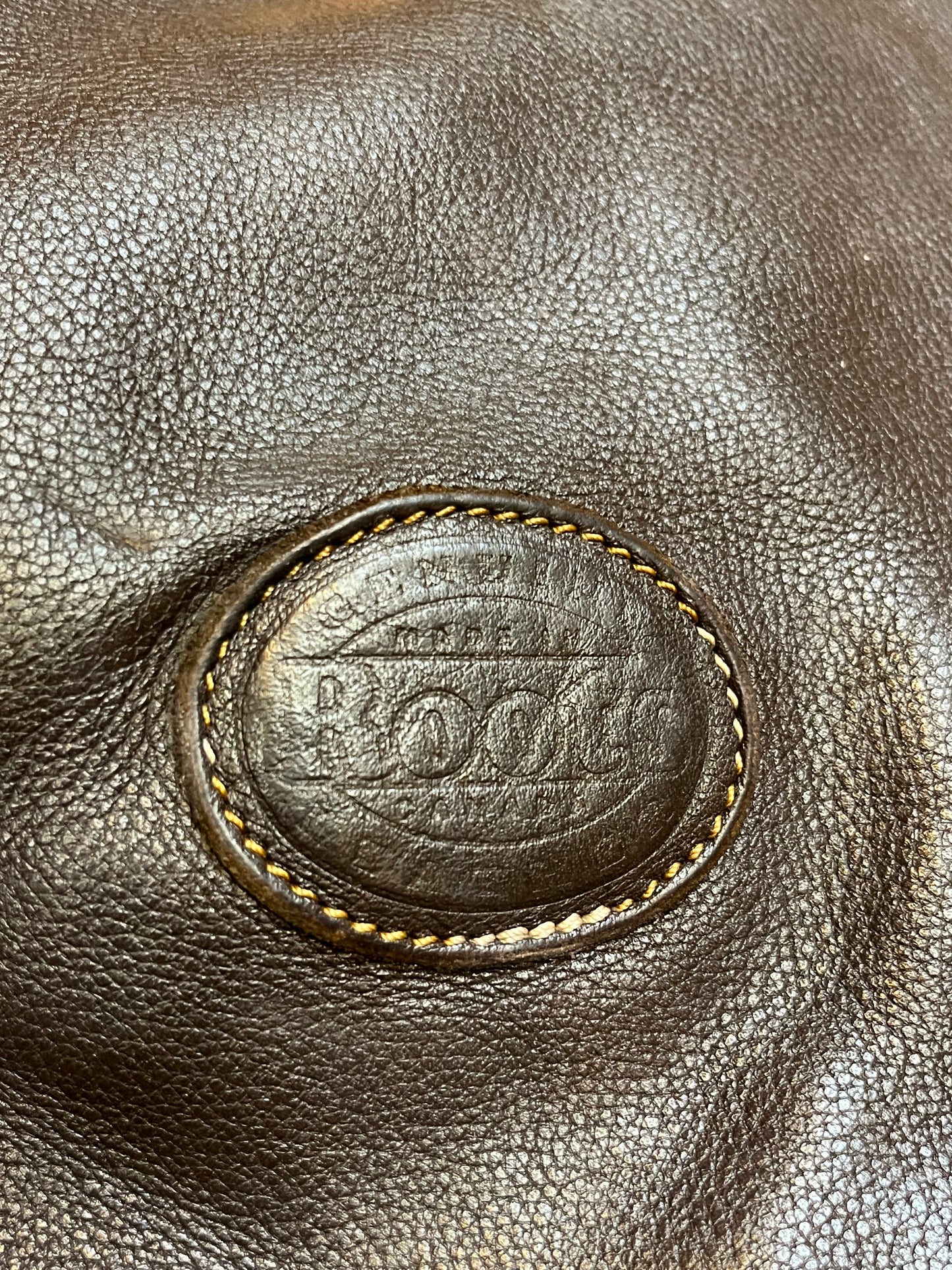 Vintage Roots Tribal Leather brown crossbody bag with adjustable shoulder strap, multiple compartments and turn key detail.