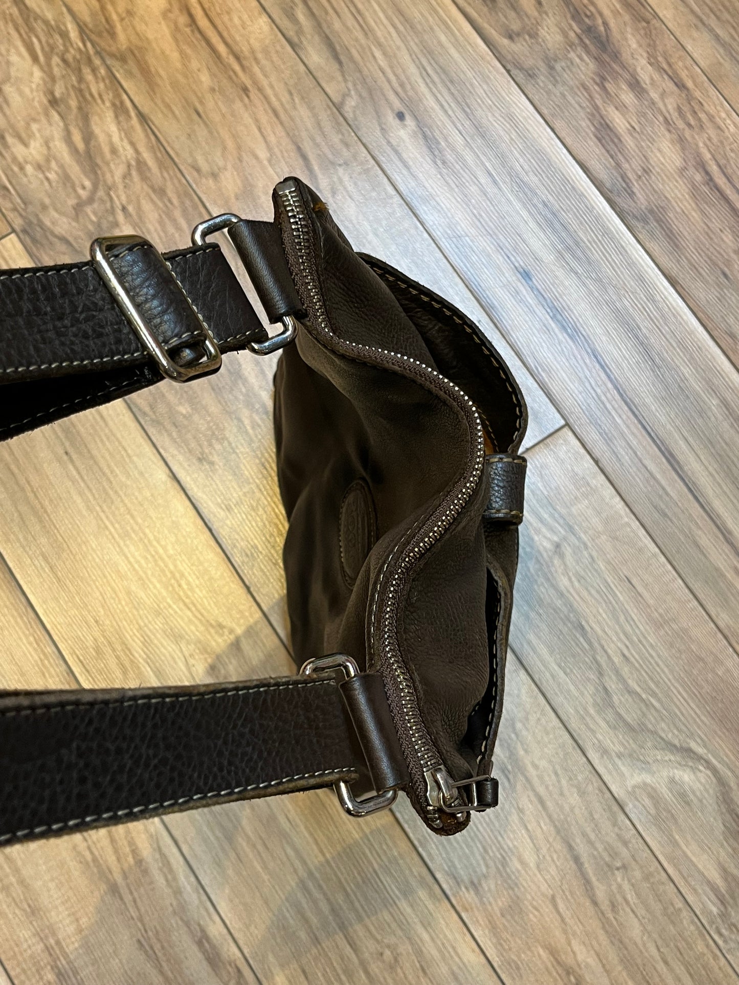 Vintage Roots Tribal Leather brown crossbody bag with adjustable shoulder strap, multiple compartments and turn key detail.