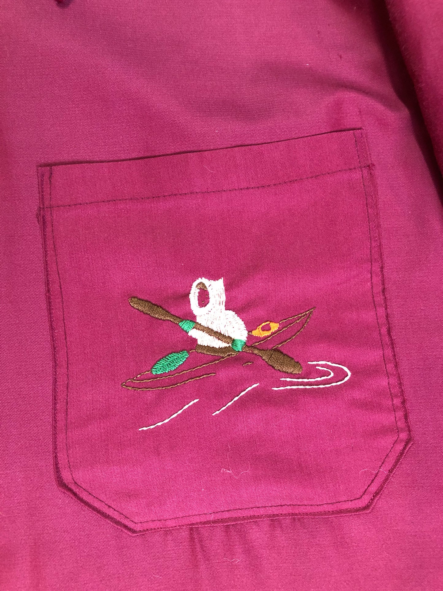 Kingspier Vintage - Pink Northern parka with wool blend lining, hood and sleeves with white fur trim, fur Pom poms, zipper closure, patch pockets, canoe design embroidered on the front pockets. Made in Canada.