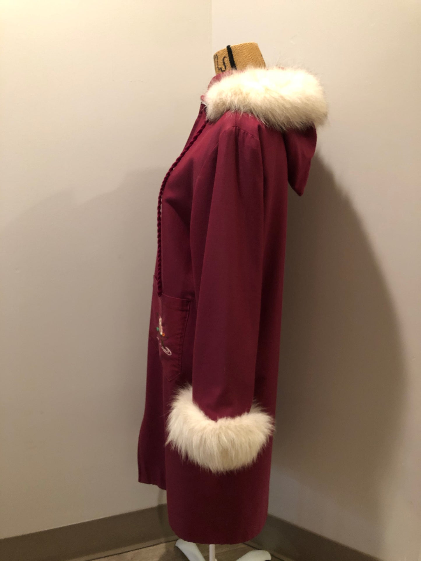 Kingspier Vintage - Pink Northern parka with wool blend lining, hood and sleeves with white fur trim, fur Pom poms, zipper closure, patch pockets, canoe design embroidered on the front pockets. Made in Canada.