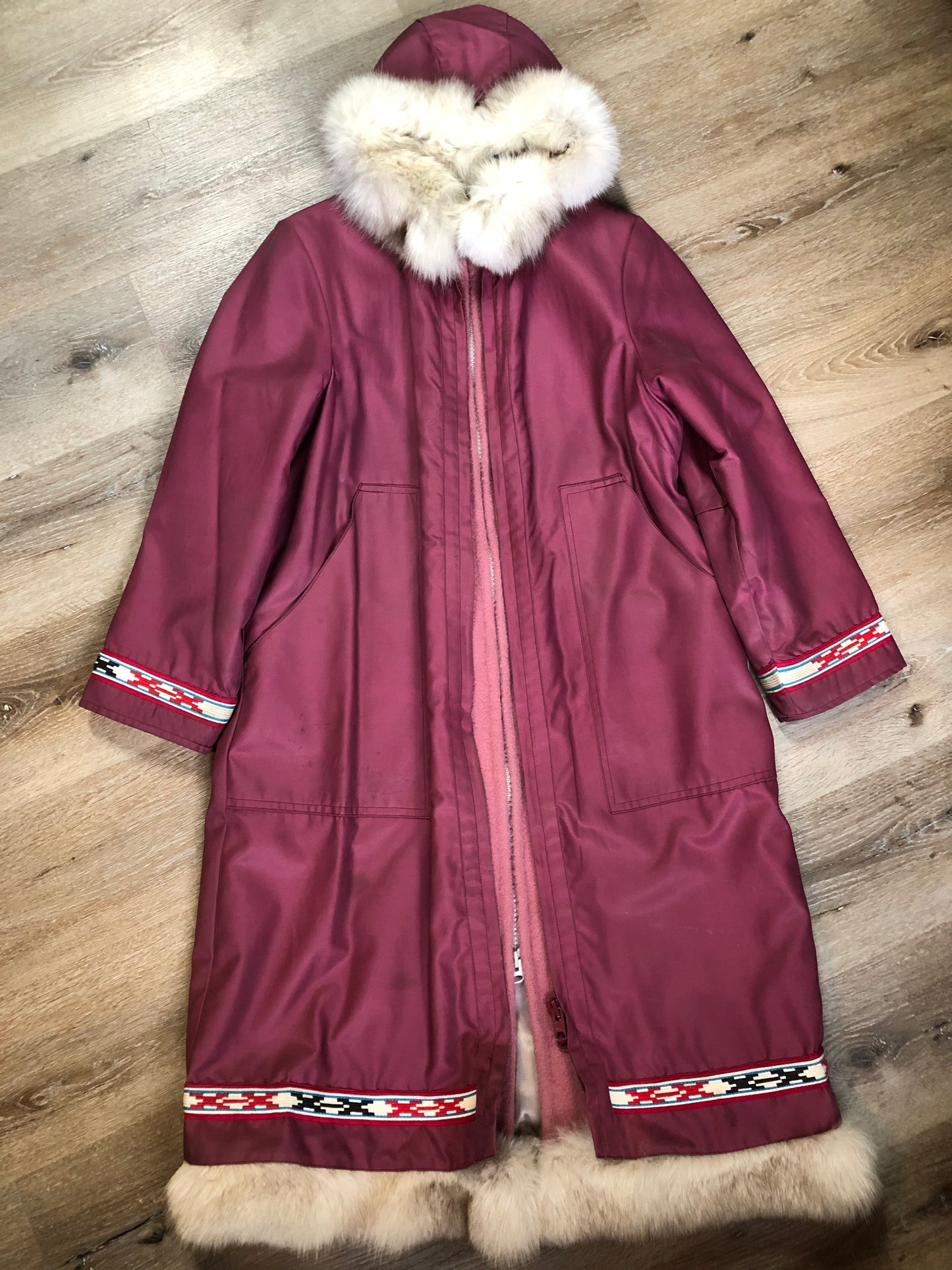 Kingspier Vintage - “Styles North” pink northern parka with removable outer shell featuring a hood with white fur trim, zipper closure, lining, patch pockets, felt warrior appliqué design on the front and back. Made in Canada.