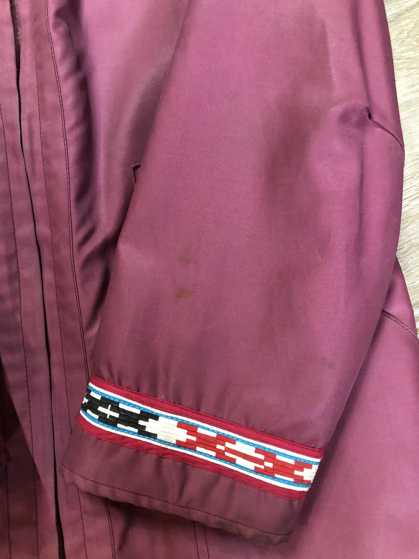 Kingspier Vintage - “Styles North” pink northern parka with removable outer shell featuring a hood with white fur trim, zipper closure, lining, patch pockets, felt warrior appliqué design on the front and back. Made in Canada.