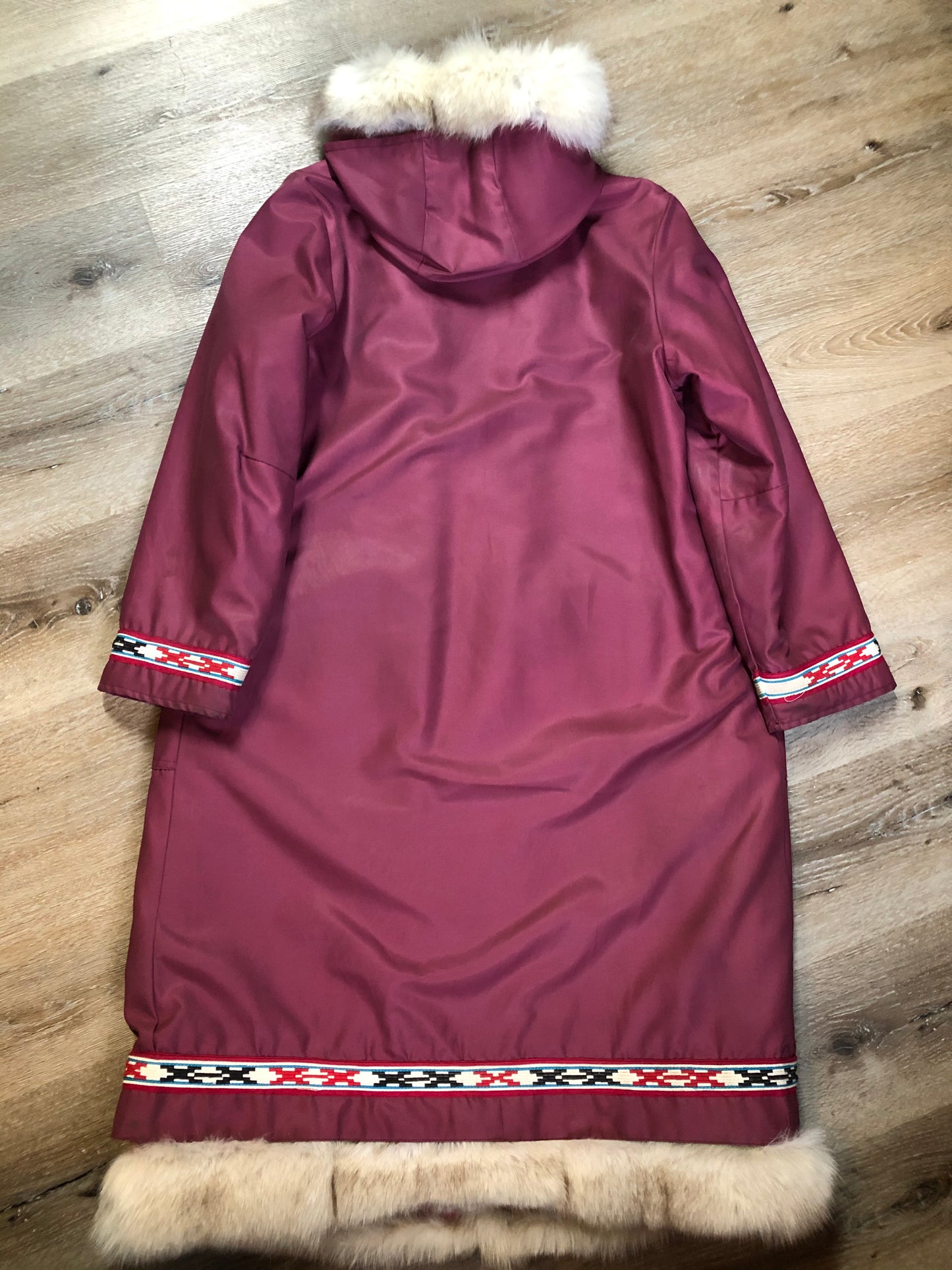 Kingspier Vintage - “Styles North” pink northern parka with removable outer shell featuring a hood with white fur trim, zipper closure, lining, patch pockets, felt warrior appliqué design on the front and back. Made in Canada.