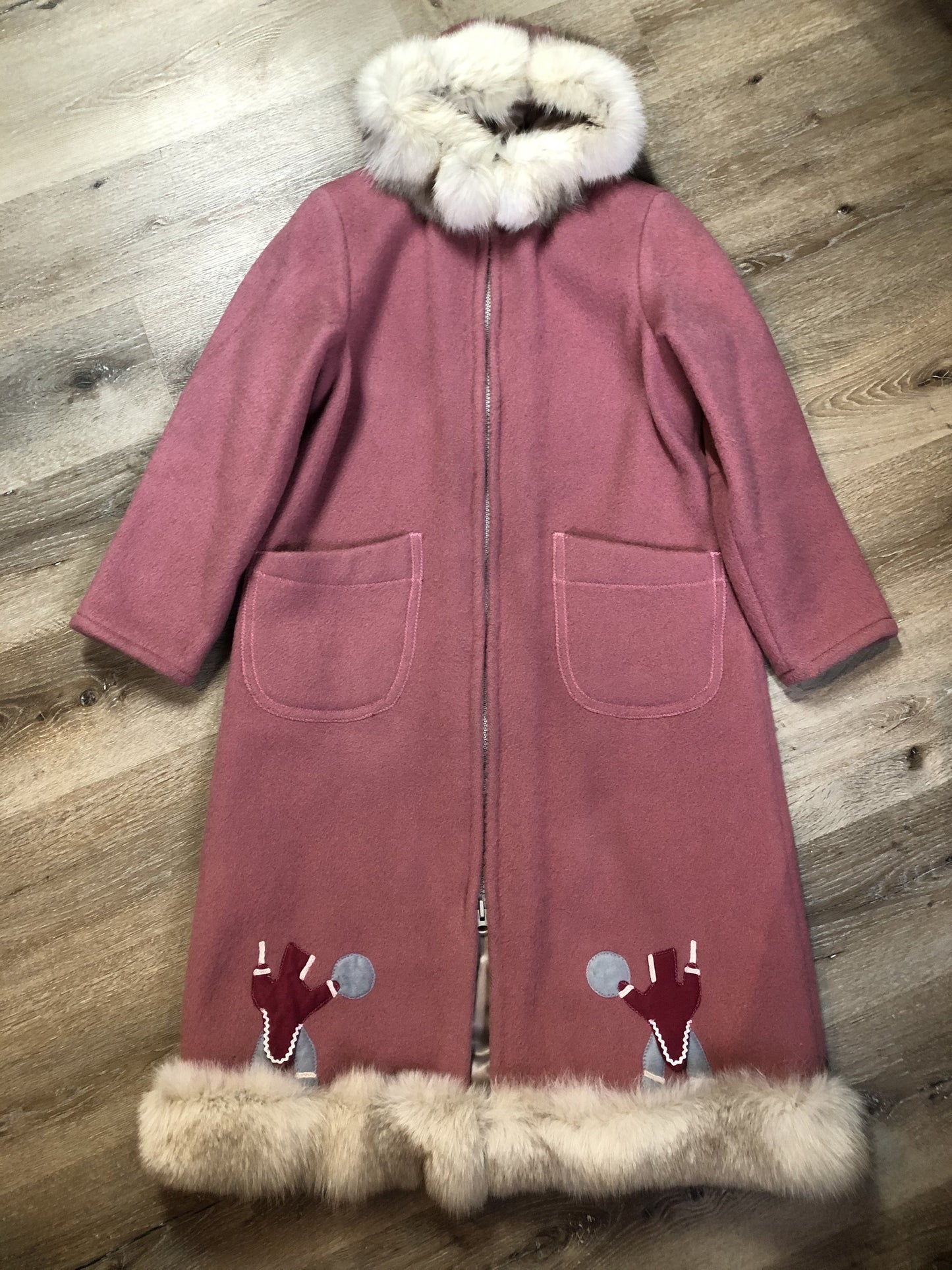 Kingspier Vintage - “Styles North” pink northern parka with removable outer shell featuring a hood with white fur trim, zipper closure, lining, patch pockets, felt warrior appliqué design on the front and back. Made in Canada.