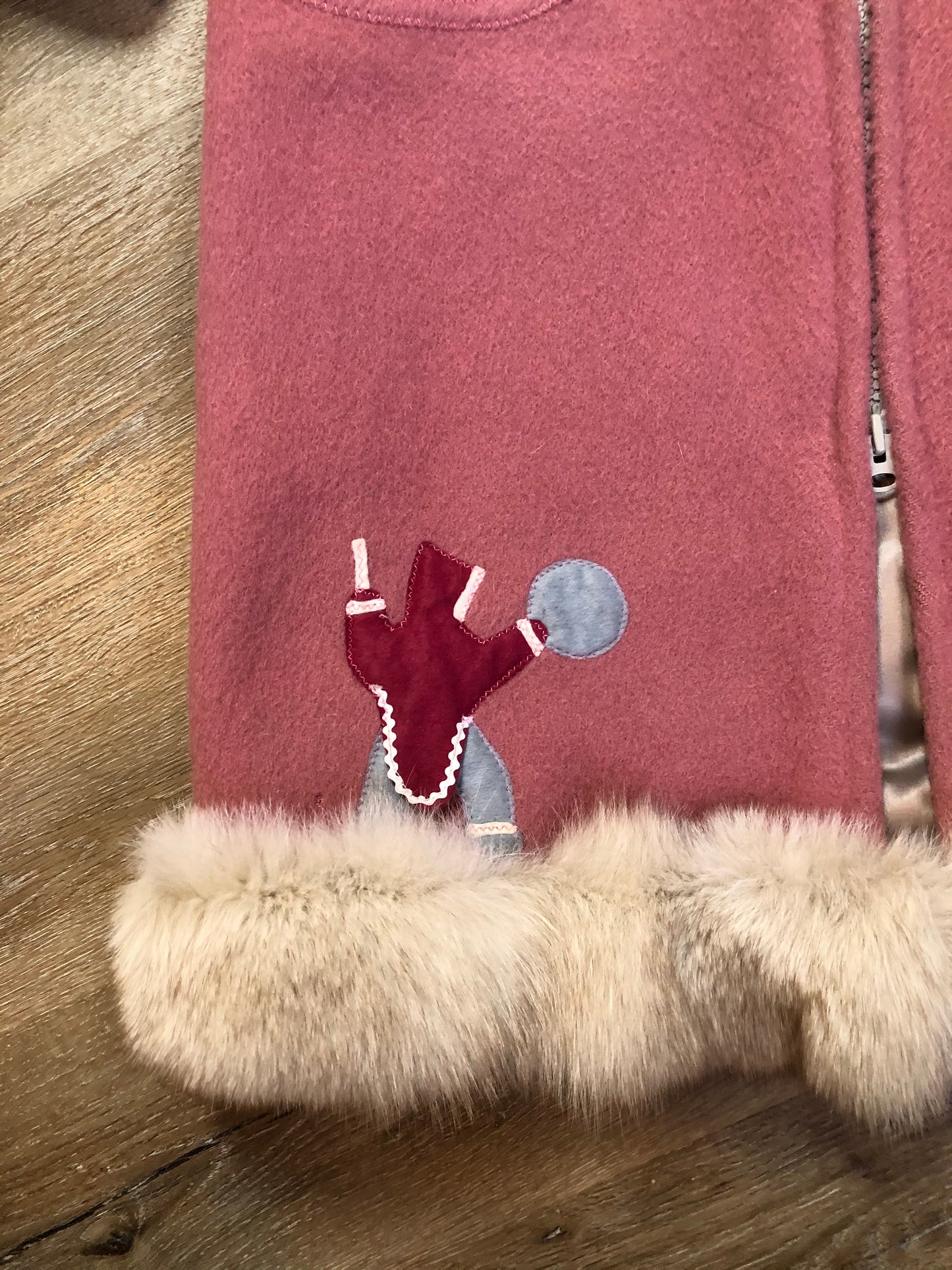 Kingspier Vintage - “Styles North” pink northern parka with removable outer shell featuring a hood with white fur trim, zipper closure, lining, patch pockets, felt warrior appliqué design on the front and back. Made in Canada.