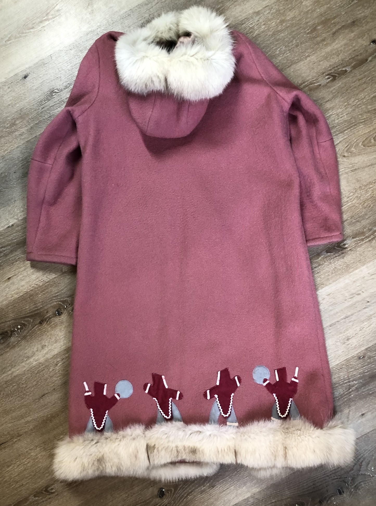 Kingspier Vintage - “Styles North” pink northern parka with removable outer shell featuring a hood with white fur trim, zipper closure, lining, patch pockets, felt warrior appliqué design on the front and back. Made in Canada.