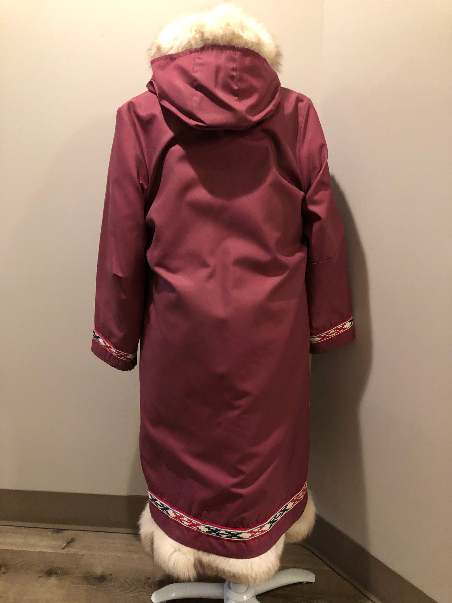 Kingspier Vintage - “Styles North” pink northern parka with removable outer shell featuring a hood with white fur trim, zipper closure, lining, patch pockets, felt warrior appliqué design on the front and back. Made in Canada.