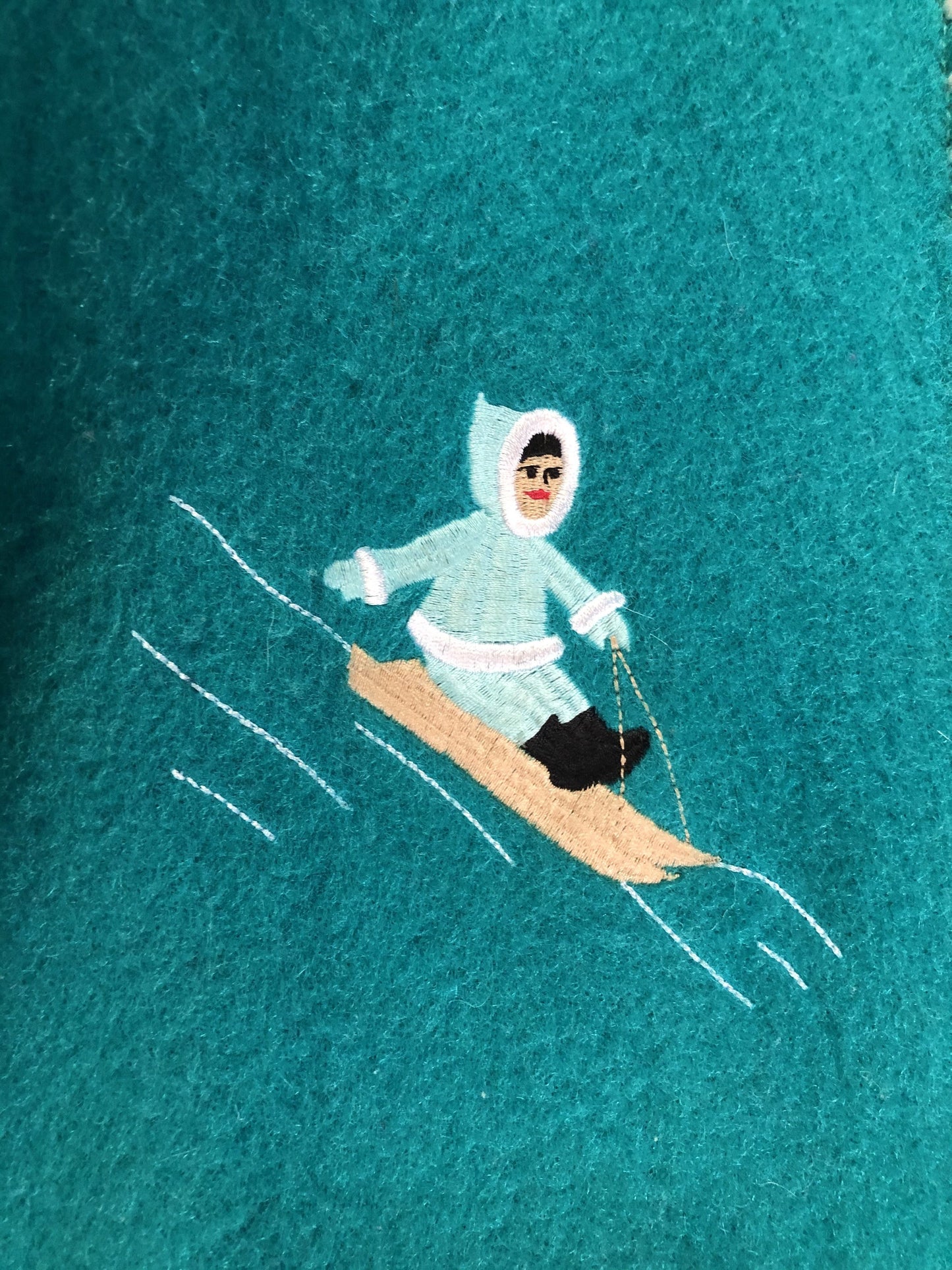 Kingspier Vintage - Children’s Turquoise Wool Humber Handcrafts northern parka featuring a hood, white fur trim, zipper closure, lining, embroidered winter scenes along the front. Made in Canada.