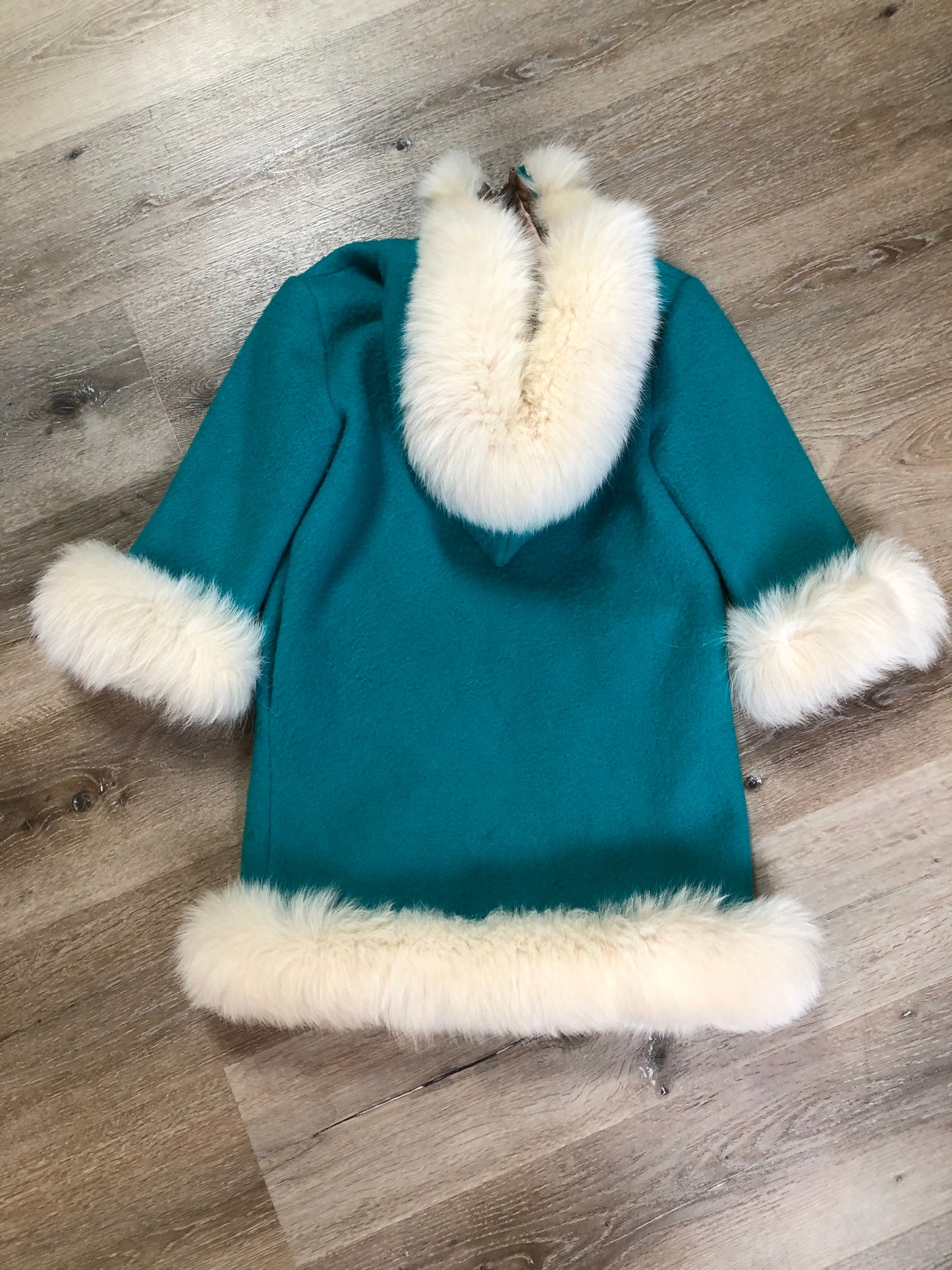 Kingspier Vintage - Children’s Turquoise Wool Humber Handcrafts northern parka featuring a hood, white fur trim, zipper closure, lining, embroidered winter scenes along the front. Made in Canada.