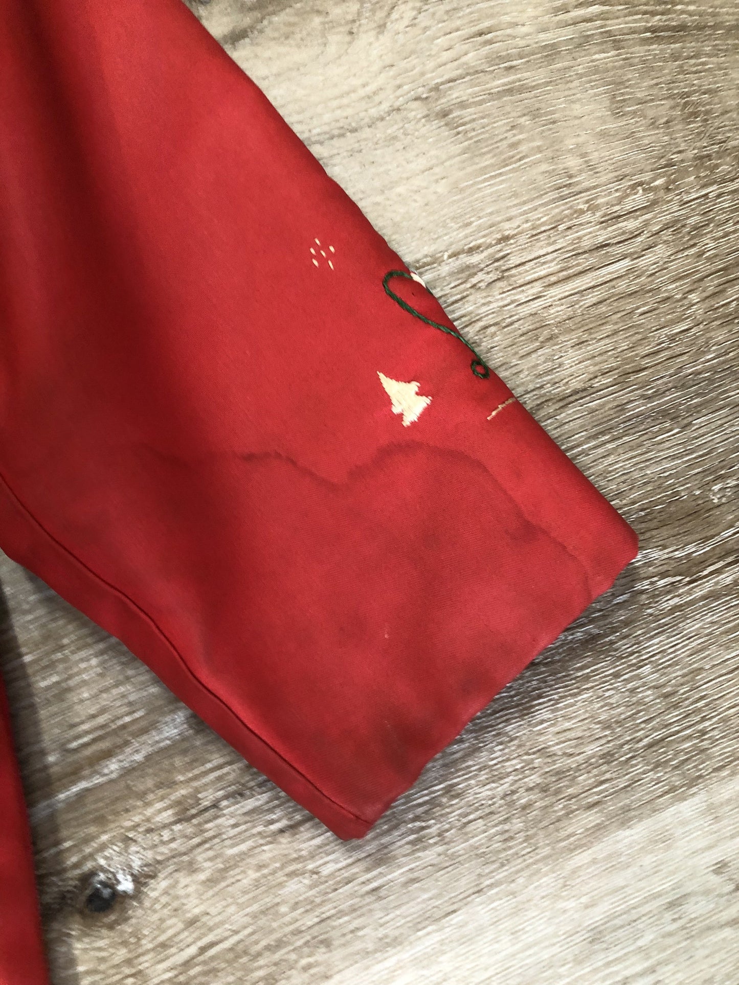 Kingspier Vintage - Children’s red northern parka featuring a hood, fur trim and pom poms, zipper closure, wool lining, patch pockets, embroidered winter scenes along the front. Made in Canada.